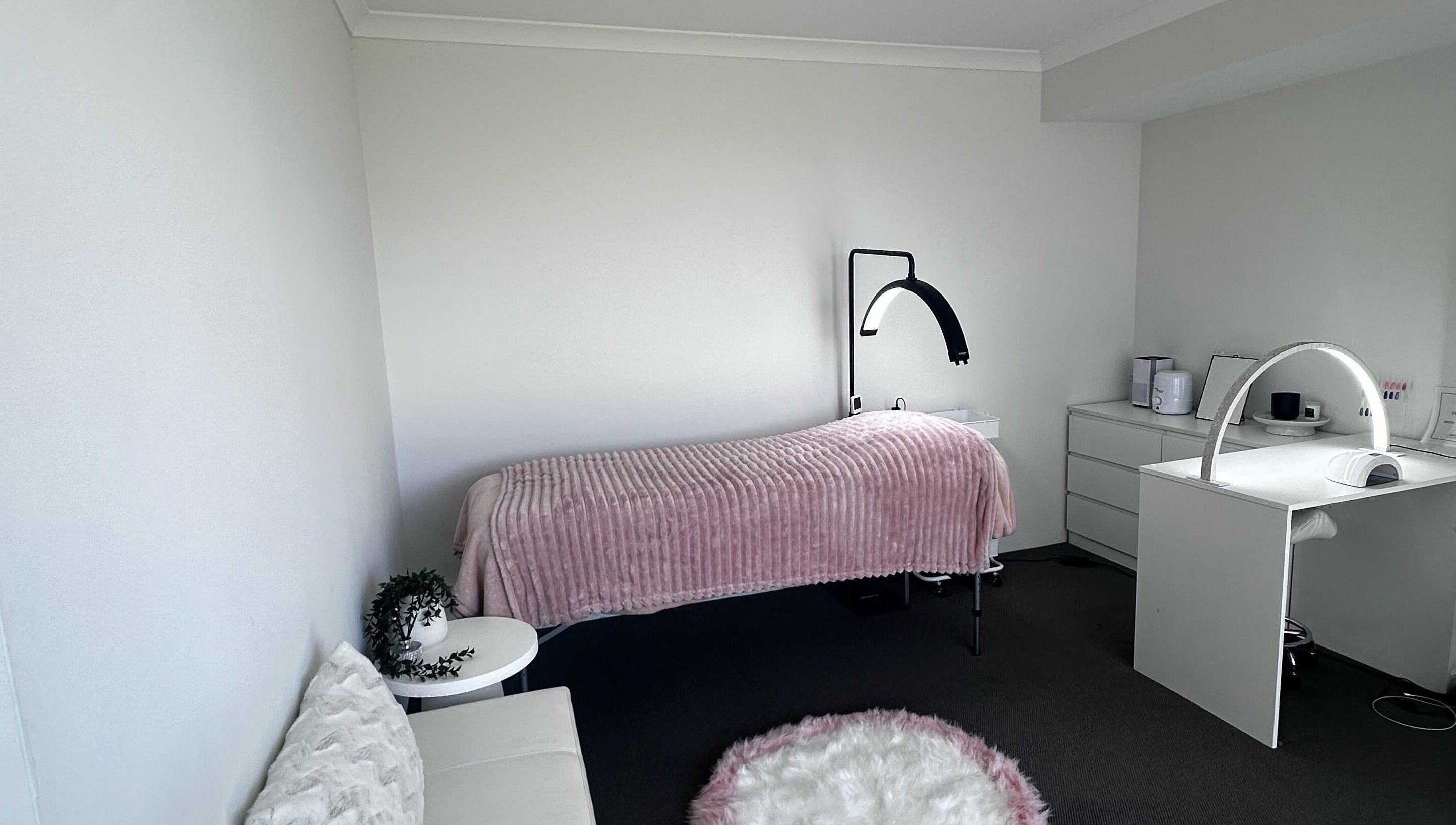 A serene treatment room at BeautifyMePerth, Two Rocks, Western Australia, AU with a cozy bed and elegant decor.