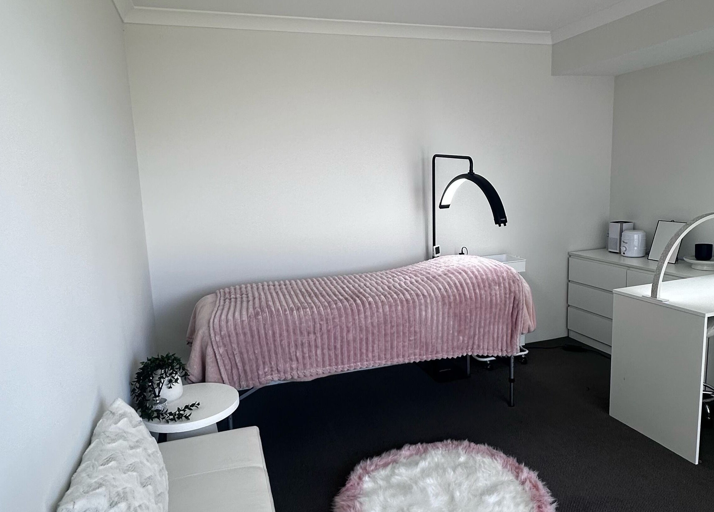 A serene treatment room at BeautifyMePerth, Two Rocks, Western Australia, AU with a cozy bed and elegant decor.