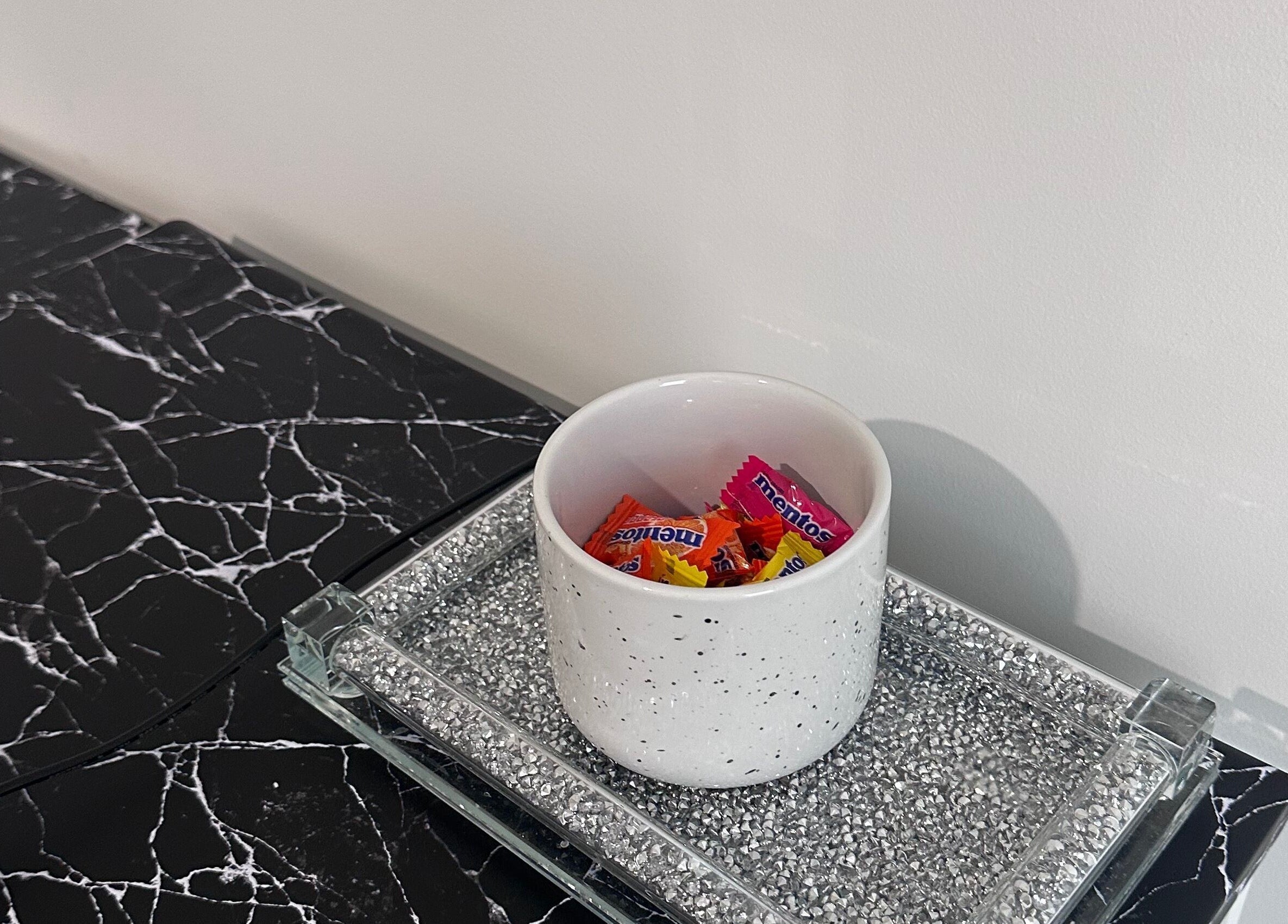 Candy bowl with colorful treats on marble counter at BeautifyMePerth, Two Rocks, Western Australia, AU.