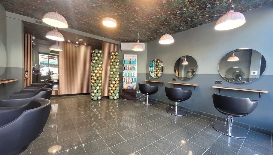 Modern salon interior at Carly Styles @ Artistic Hair Co., Bristol, England, GB, featuring elegant styling chairs.