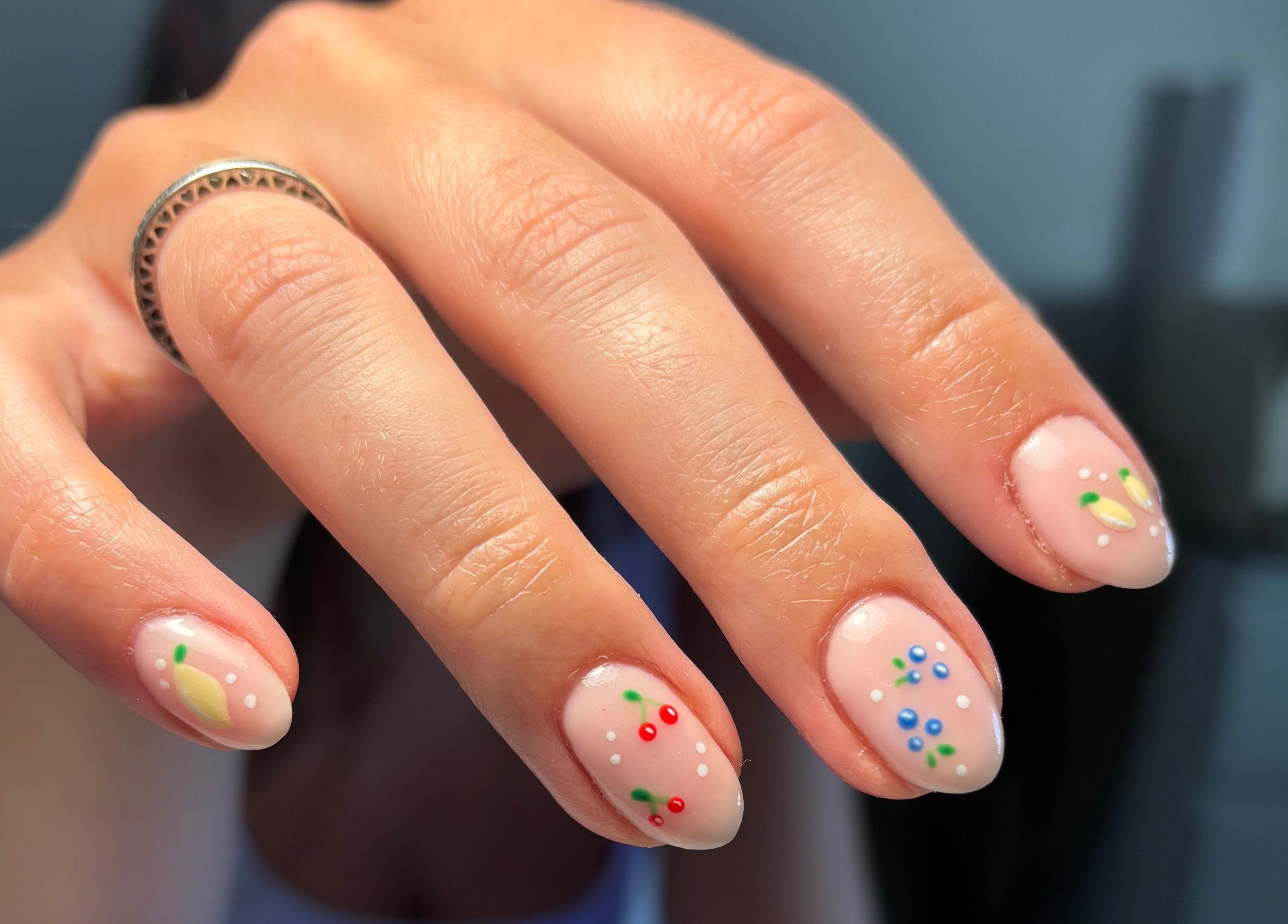 Elegant nail art with colorful dots and designs at So Gel, Kesgrave, England, GB.