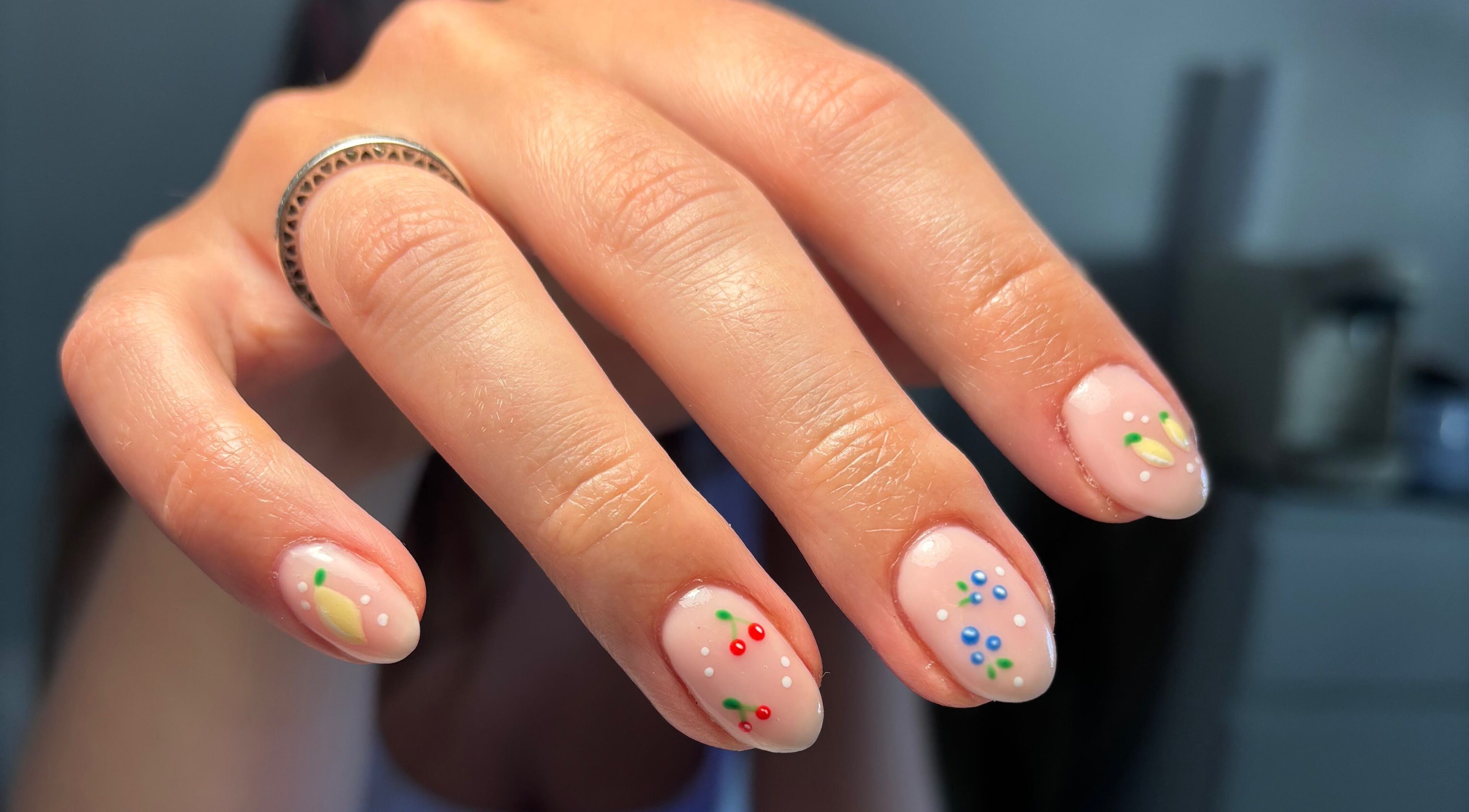 Elegant nail art with colorful dots and designs at So Gel, Kesgrave, England, GB.
