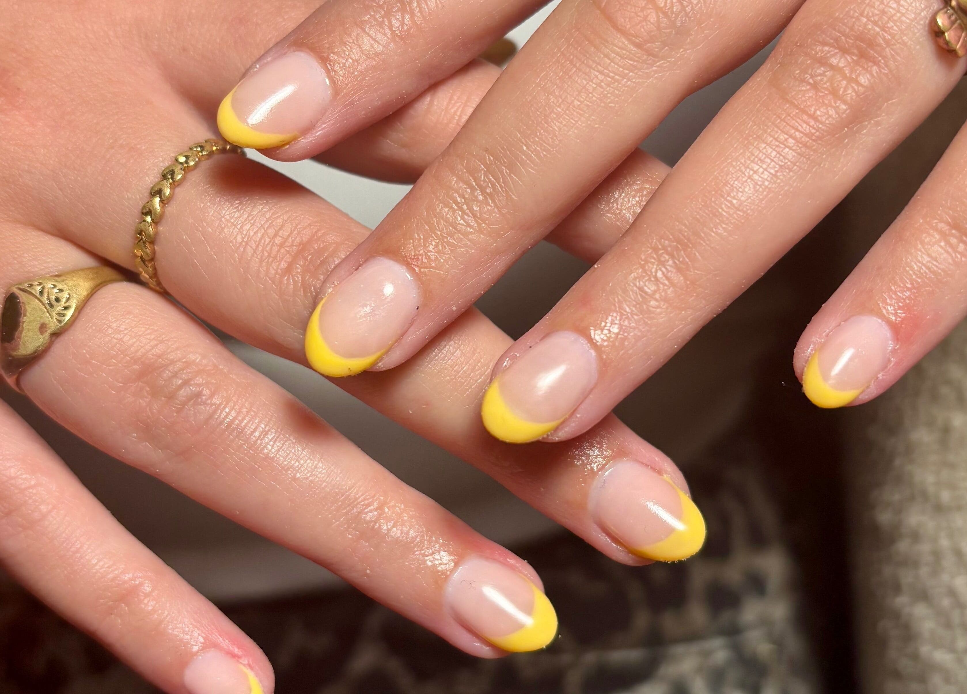 Stylish yellow-tipped nails at So Gel, Kesgrave, England, GB. Perfect for a chic manicure.