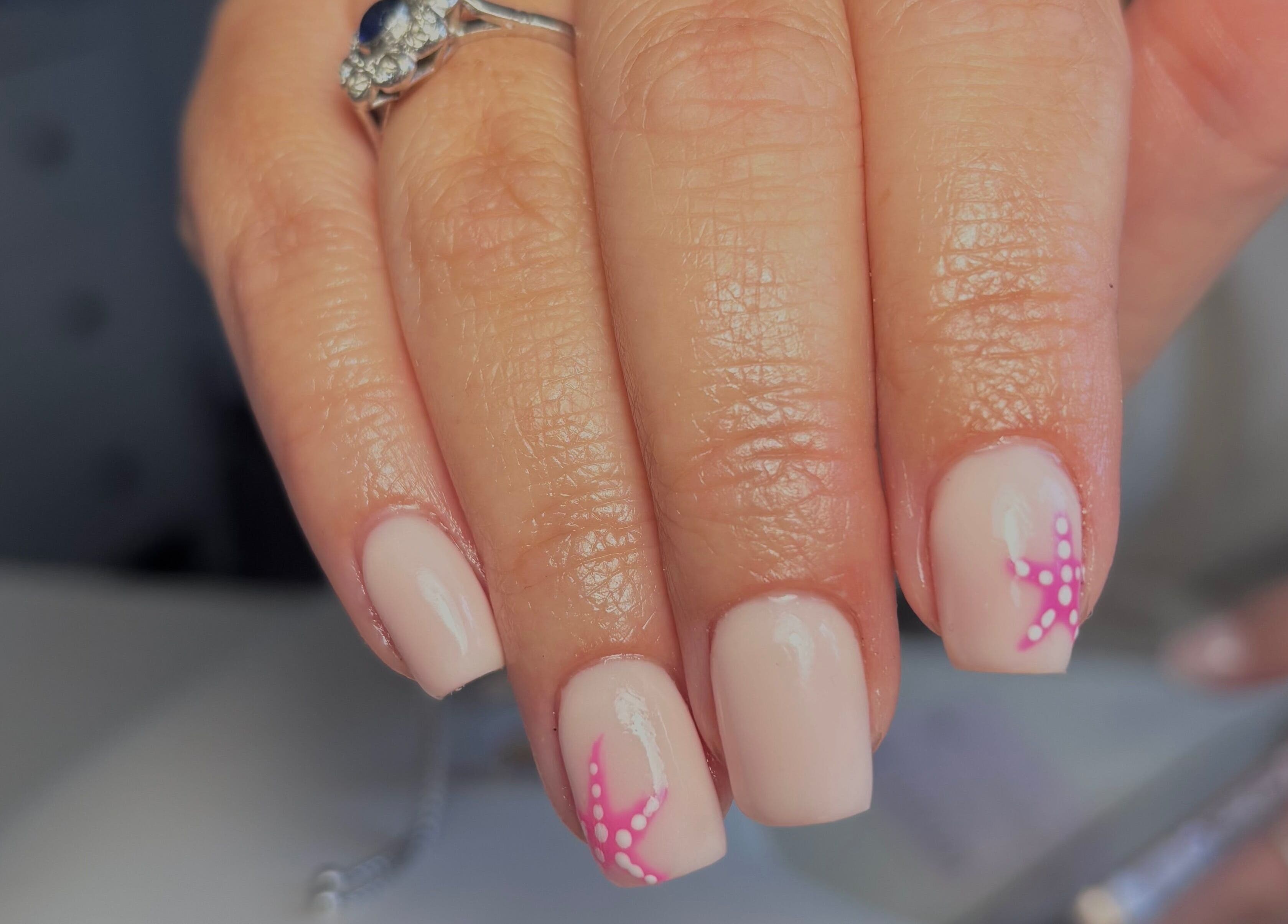 Elegant nail art with pink star design at So Gel, Kesgrave, England, GB. Perfect for stylish manicure lovers.