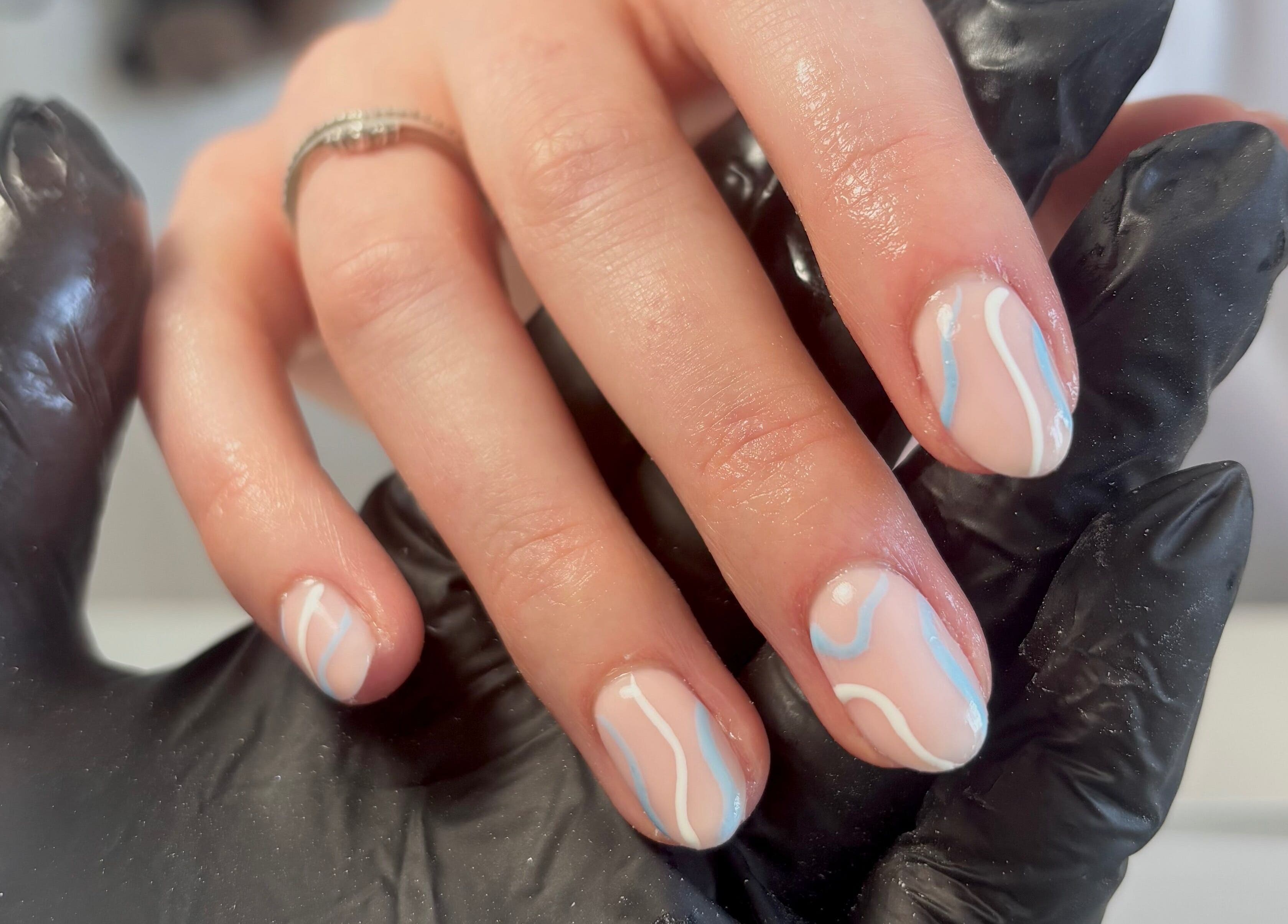 Nail art with blue and white waves at So Gel, Kesgrave, England, GB. Chic and stylish manicure.
