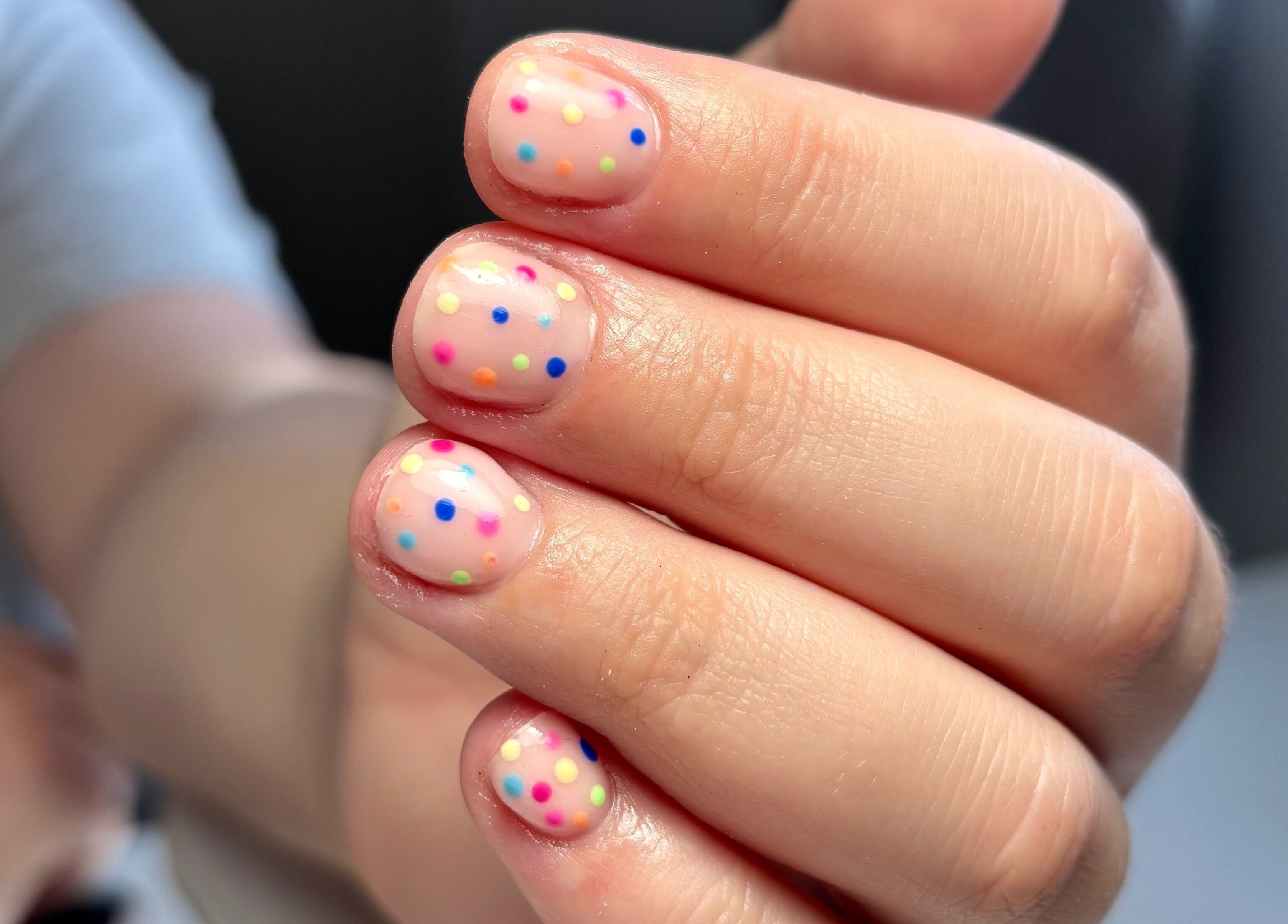 Colorful polka dot nails at So Gel, Kesgrave, England, GB. Perfect for a playful and vibrant look.