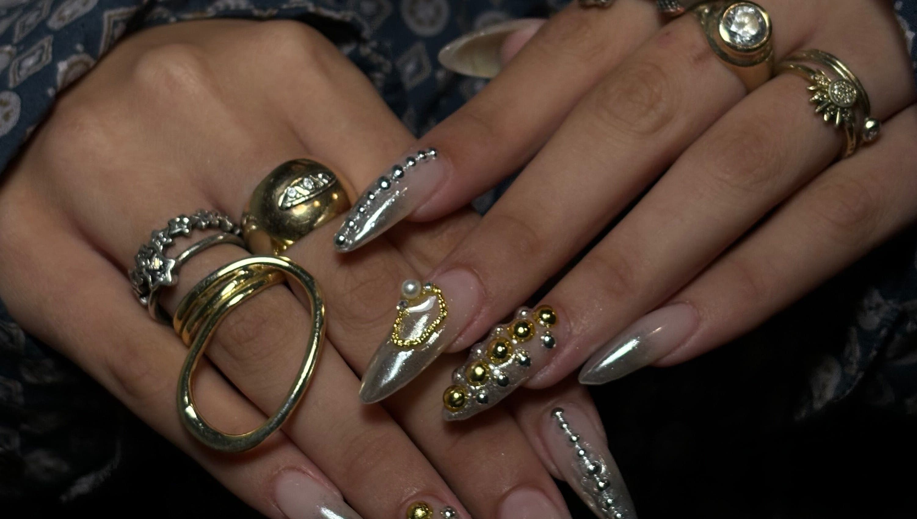 Glittering nail art with gold embellishments at Agrresandra Nail Atelier, Sofia, Sofia City Province, BG.