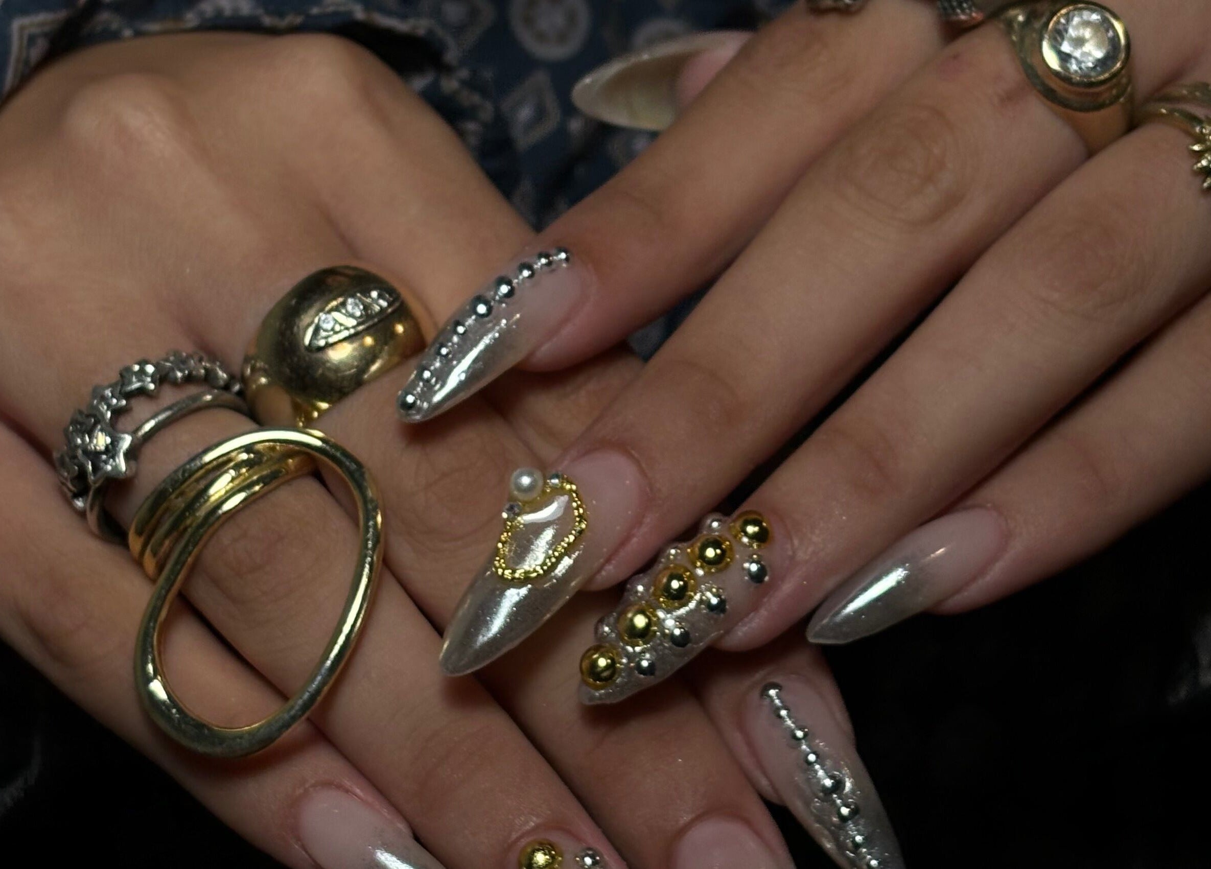 Glittering nail art with gold embellishments at Agrresandra Nail Atelier, Sofia, Sofia City Province, BG.