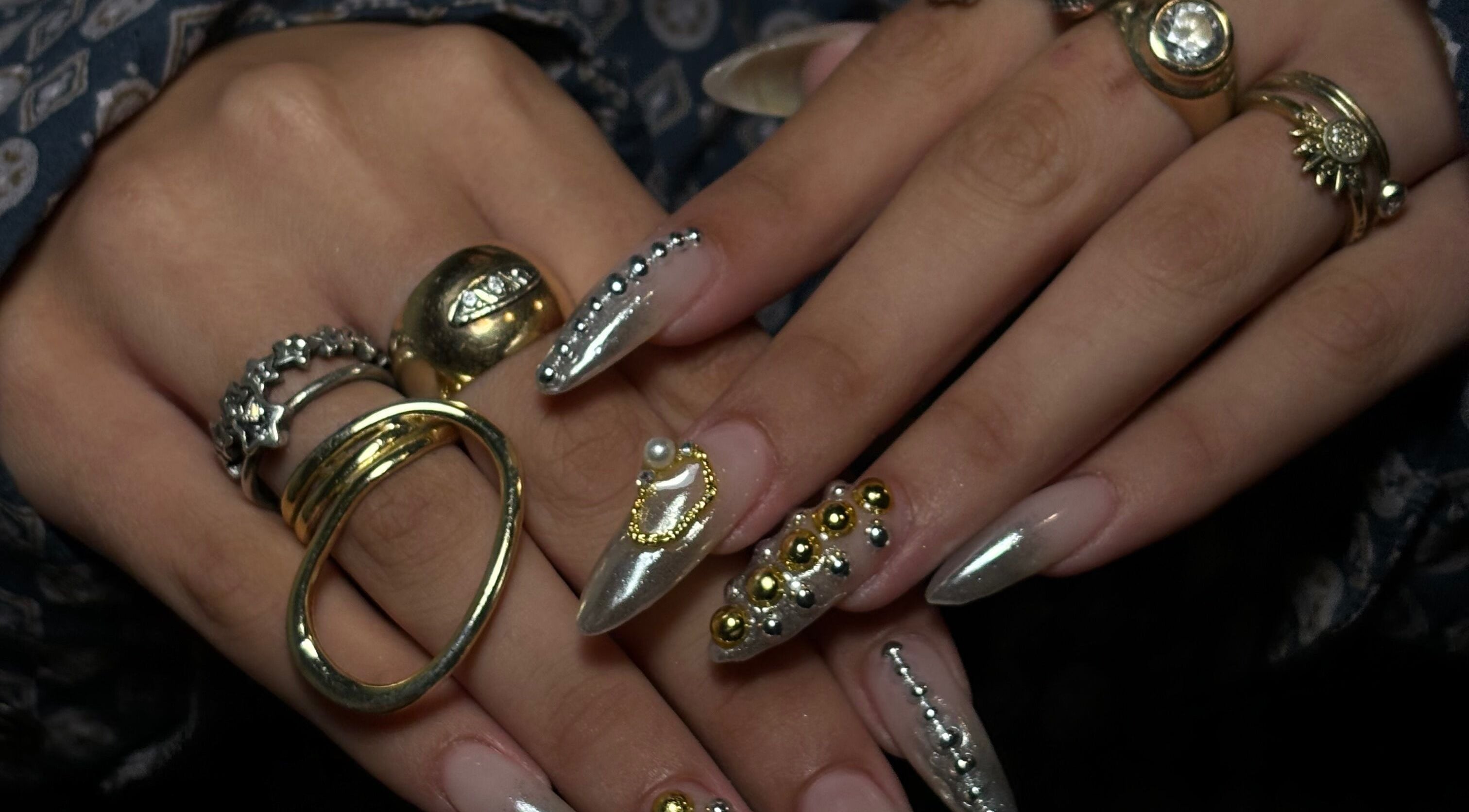 Glittering nail art with gold embellishments at Agrresandra Nail Atelier, Sofia, Sofia City Province, BG.