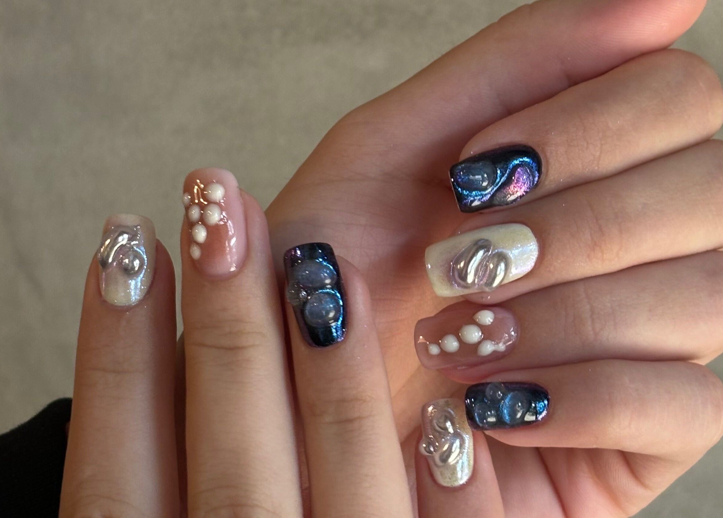 Stunning nail art at Agrresandra Nail Atelier, Sofia, featuring pearls and shimmer.