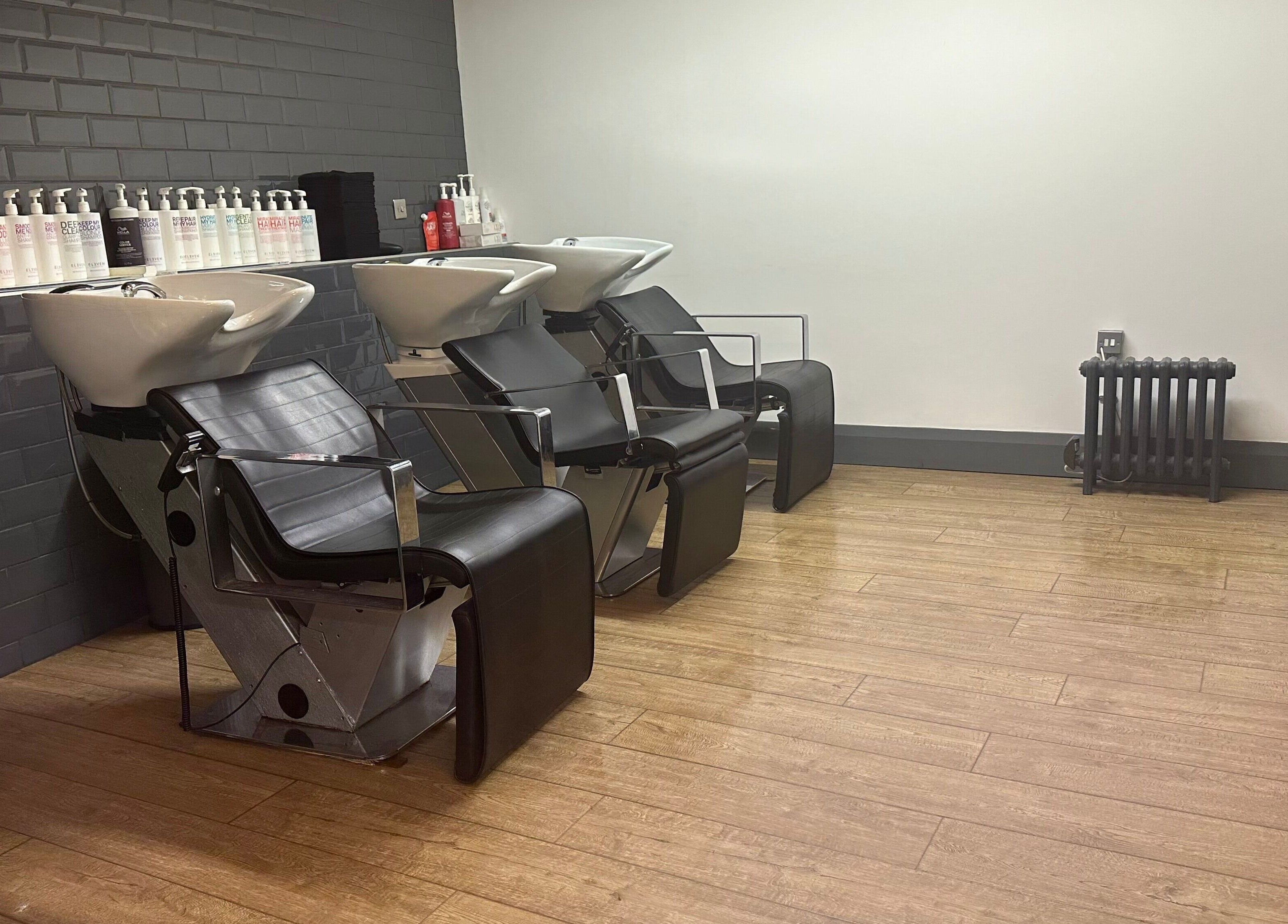 Modern hair wash stations at So & So Hairdressing in Whitley Bay, England, GB.