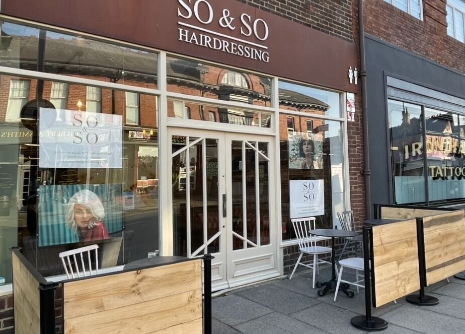Front view of So & So Hairdressing salon in Whitley Bay, England, GB, showcasing modern exterior design.