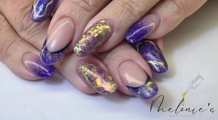 Stunning galaxy-themed nails at Melonie's Nail Salon, Hastings, England, GB, showcasing intricate purple nail art.