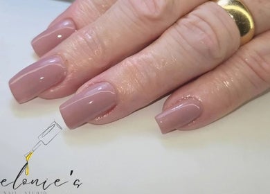 Elegant nude manicure at Melonie's Nail Salon, Hastings, England, GB showcasing glossy finish.