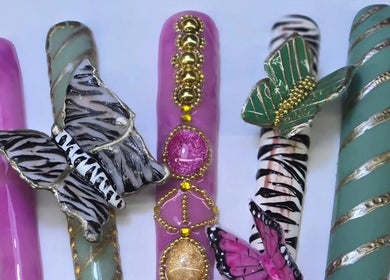 Intricate butterfly-themed nail art at Melonie's Nail Salon, Hastings, England, GB.