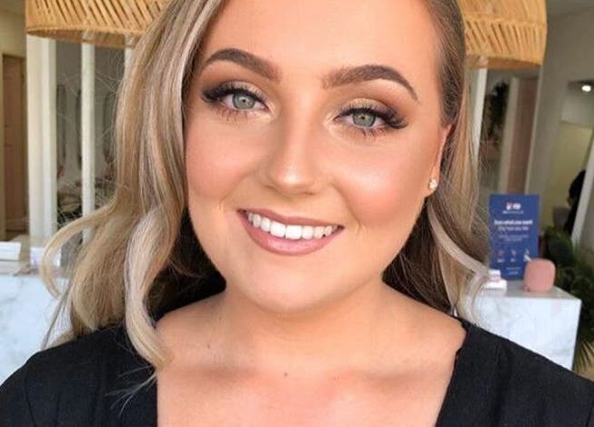 Smiling woman with makeup at The House of Lashes Beauty Bar, Robina, Queensland, AU.