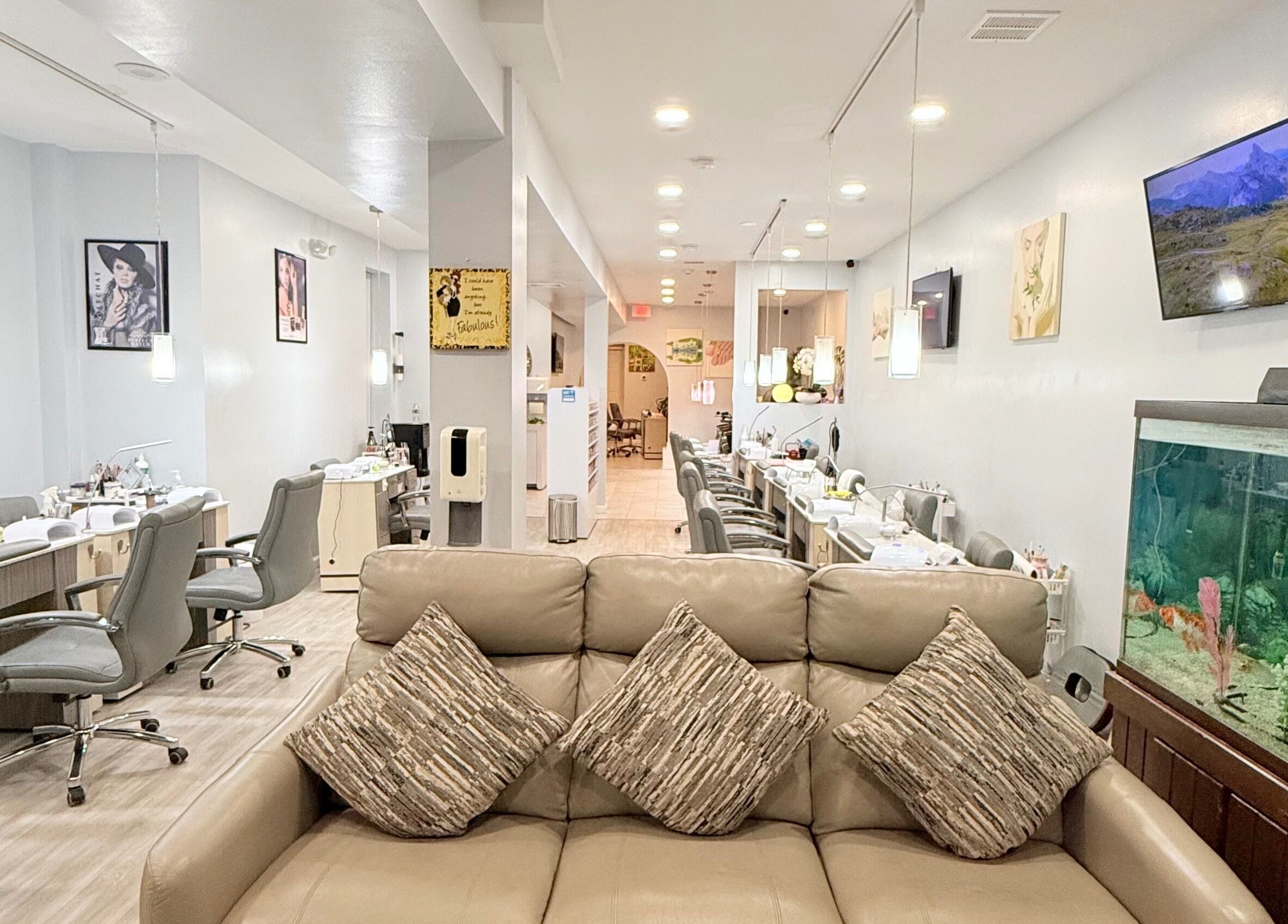 Interior of A&T NAIL SALON in Somerville, New Jersey, US featuring stylish seating and modern decor.