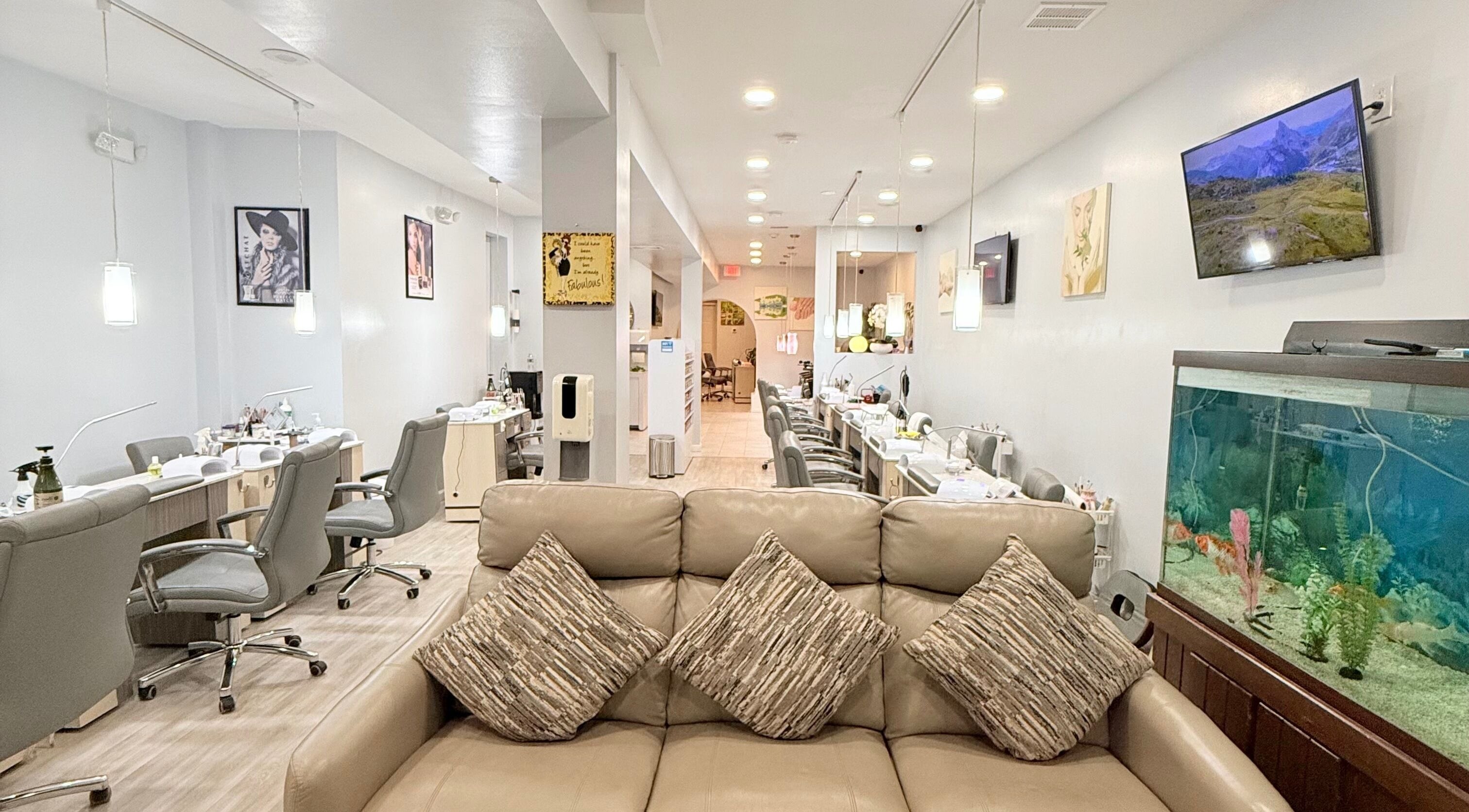 Interior of A&T NAIL SALON in Somerville, New Jersey, US featuring stylish seating and modern decor.