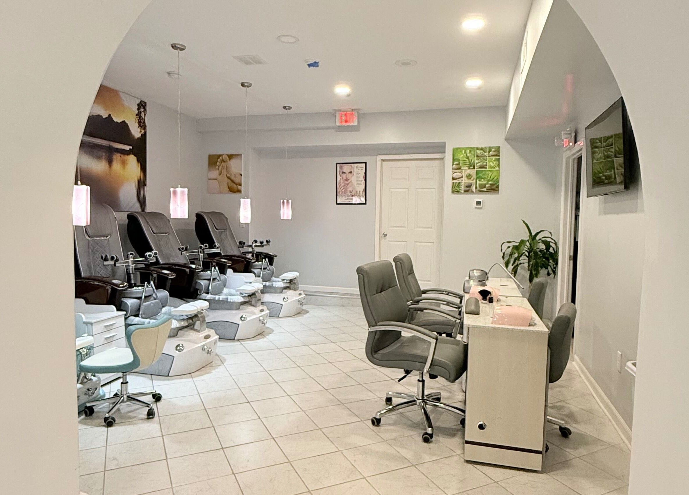 Relaxing interior of A&T NAIL SALON, Somerville, New Jersey, US, featuring comfortable pedicure chairs.
