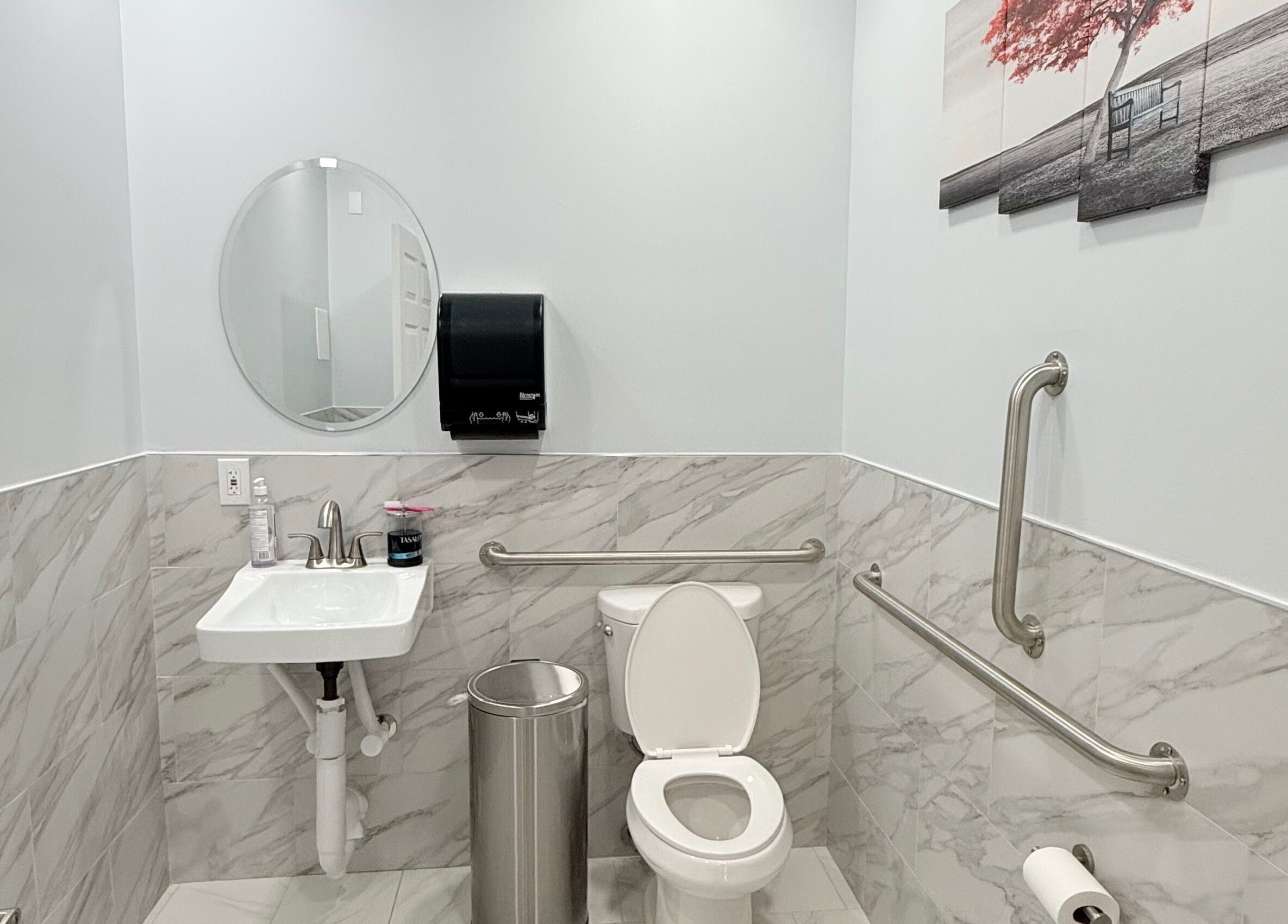 Elegant restroom at A&T NAIL SALON in Somerville, New Jersey with modern marble accents and accessibility features.