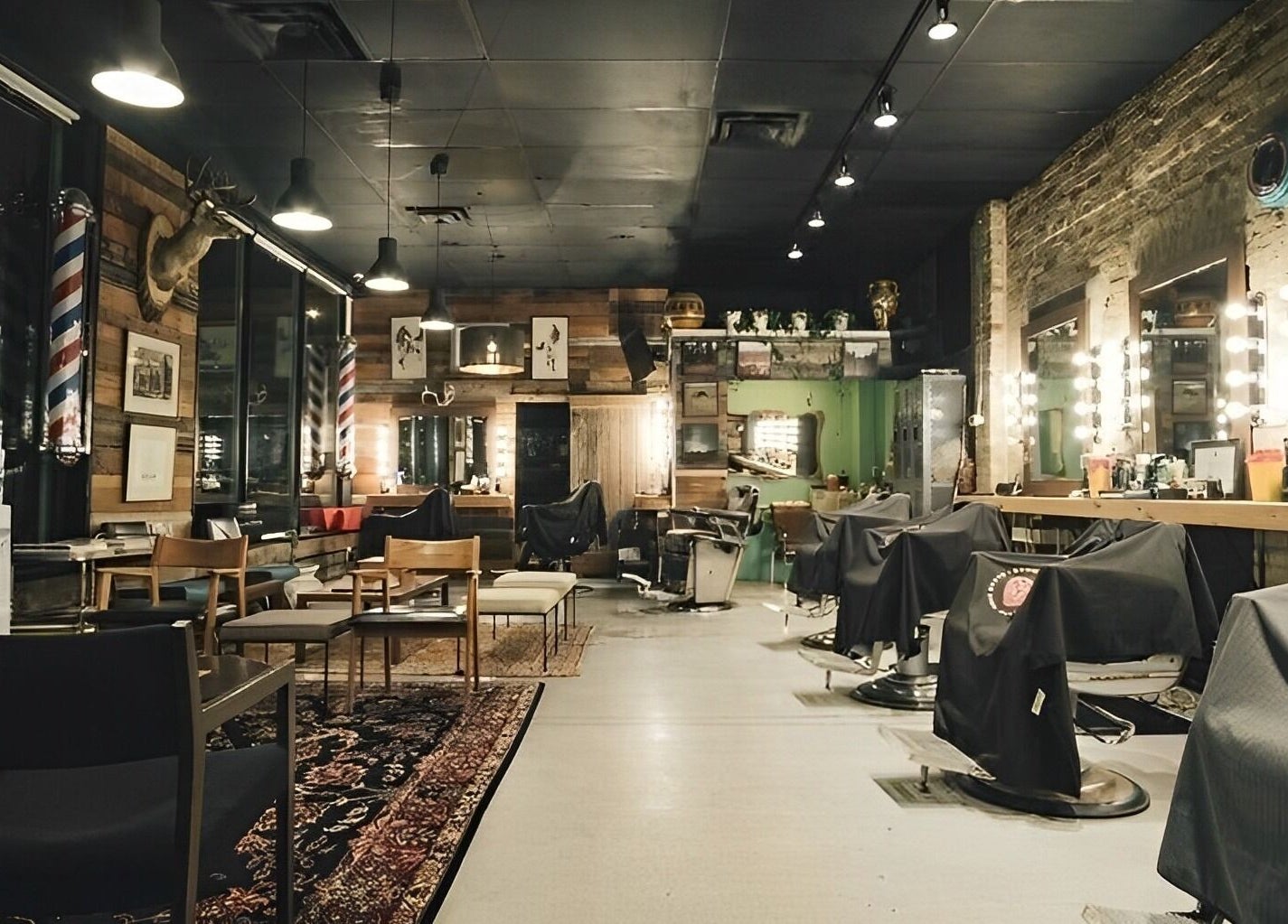Cozy interior of The Loving Barbers Company in Winnipeg, Manitoba, CA featuring stylish rustic decor and barber chairs.