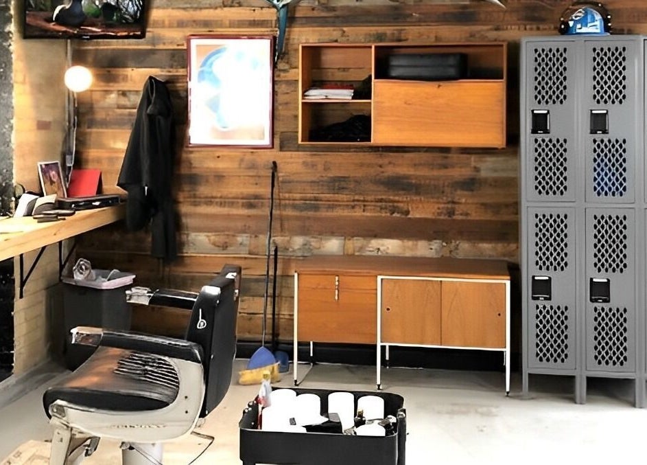 Chic barber station of The Loving Barbers Company in Winnipeg, Manitoba, CA with vintage chair and wood paneling.