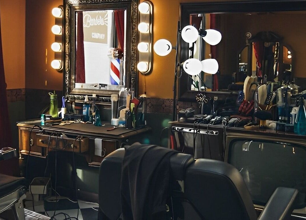 Cozy interior of The Loving Barbers Company, Winnipeg, Manitoba, CA, featuring vintage decor and barber tools.