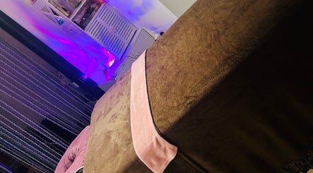 Relaxing massage table at Sparkle Well-being, Saltcoats, Scotland, GB with ambient lighting.