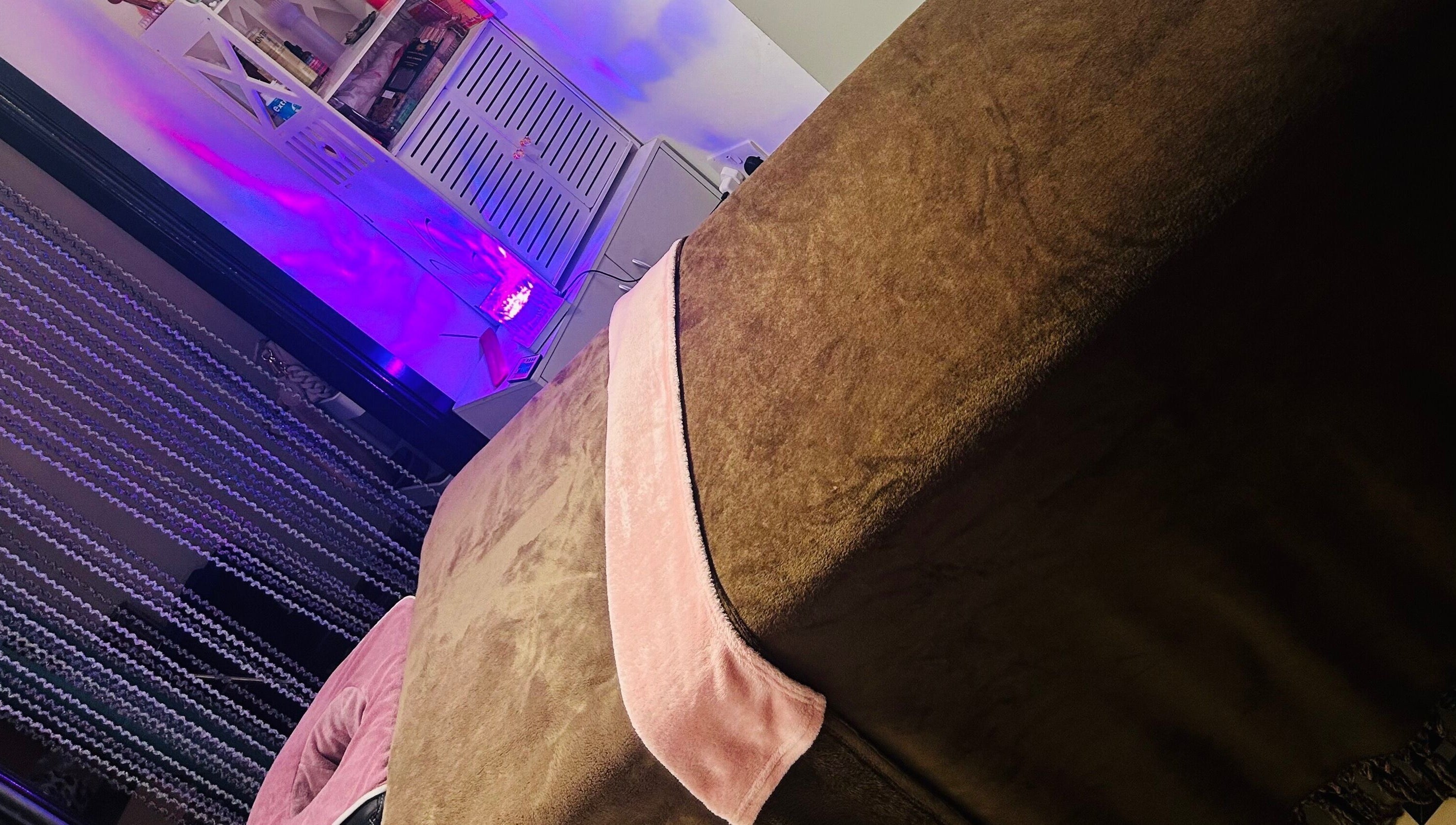 Relaxing treatment room with soft lighting at Sparkle Well-being, Saltcoats, Scotland, GB.