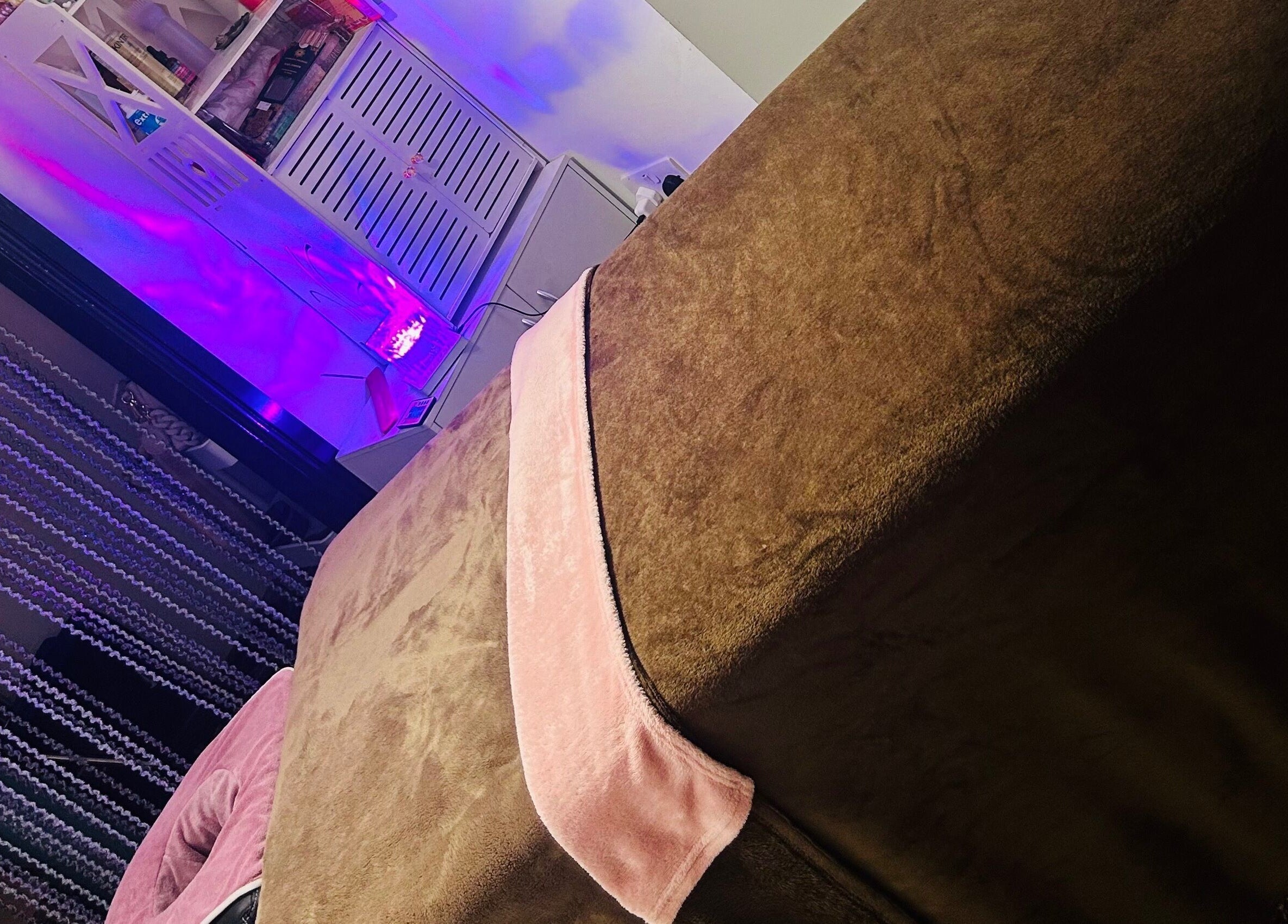 Relaxing treatment room with soft lighting at Sparkle Well-being, Saltcoats, Scotland, GB.