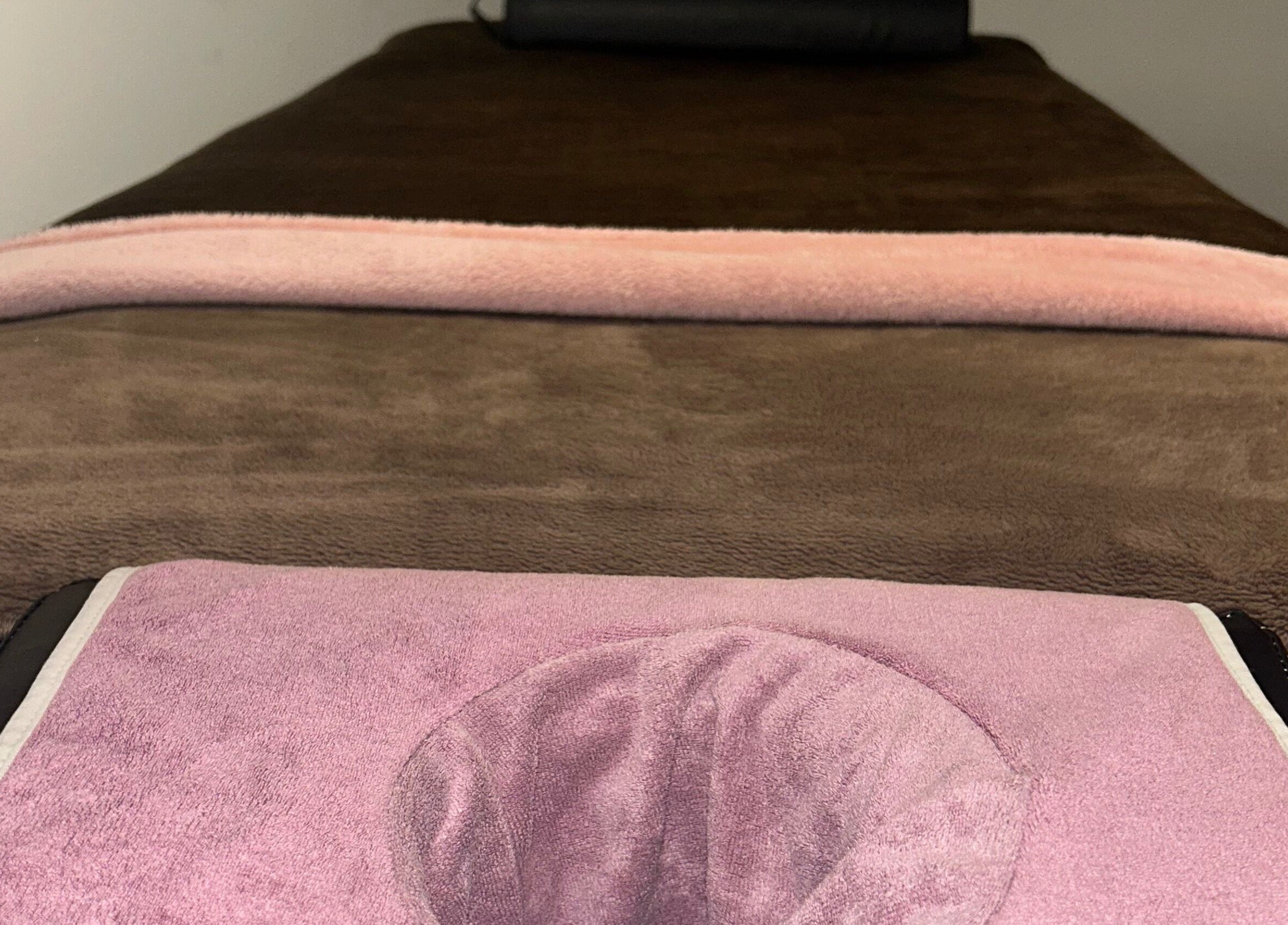 Comfortable massage bed at Sparkle Well-being, Saltcoats, Scotland, GB, inviting relaxation and wellness.