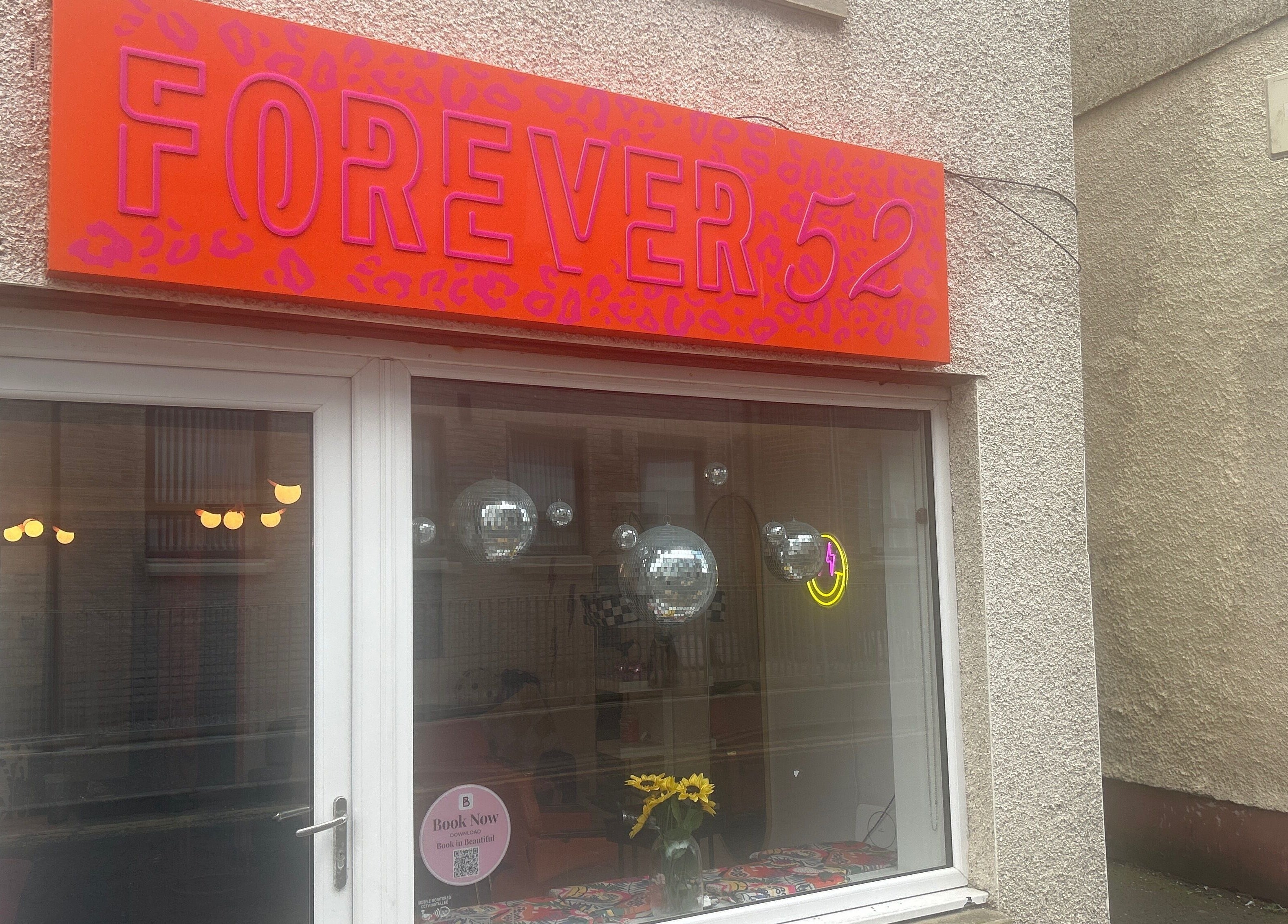 Sparkle Well-being venue in Saltcoats, Scotland featuring a colorful exterior with bright signage.