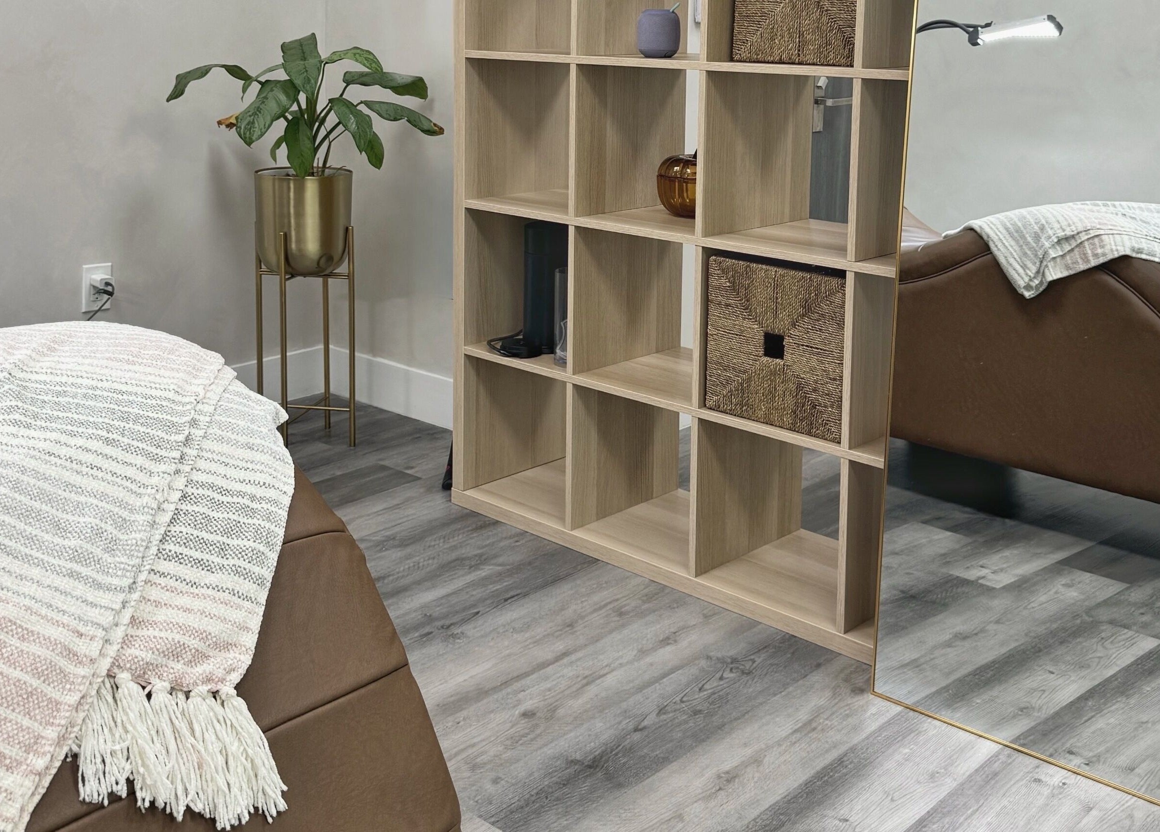 Cozy therapy room at THE LAB with a massage bed and plant decor in Miami, Florida, US.