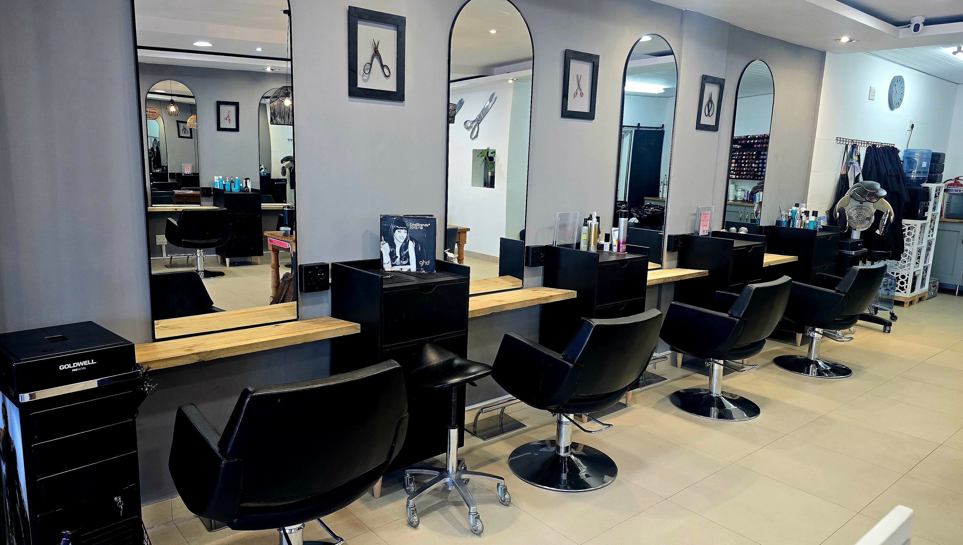Modern styling stations at Pink Scissors Shop - Shop4 Ocean Square Sunset Beach, Cape Town, Western Cape, ZA.