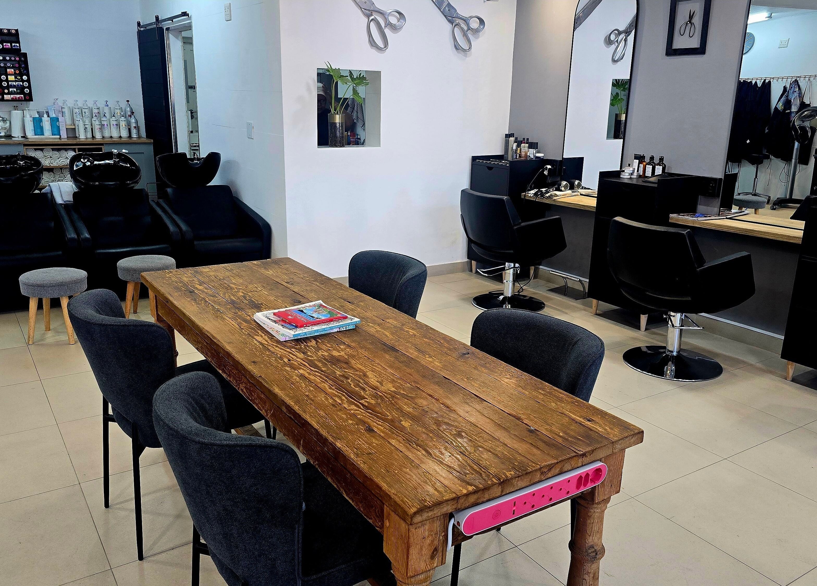 Modern interior of Pink Scissors Shop - Shop4 Ocean Square Sunset Beach, Cape Town, Western Cape, ZA.