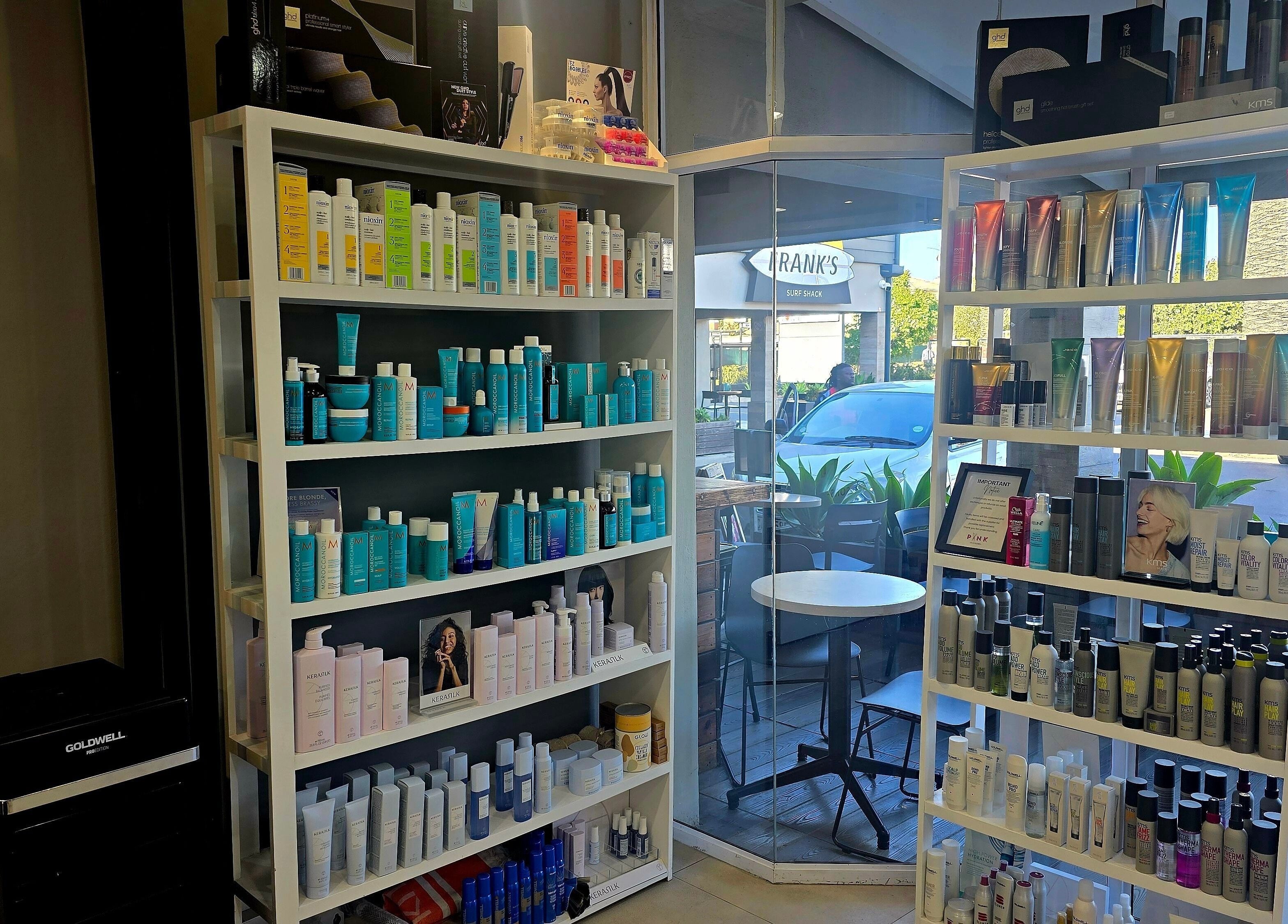 Product shelves at Pink Scissors Shop - Shop4 Ocean Square Sunset Beach, Cape Town, Western Cape, ZA.