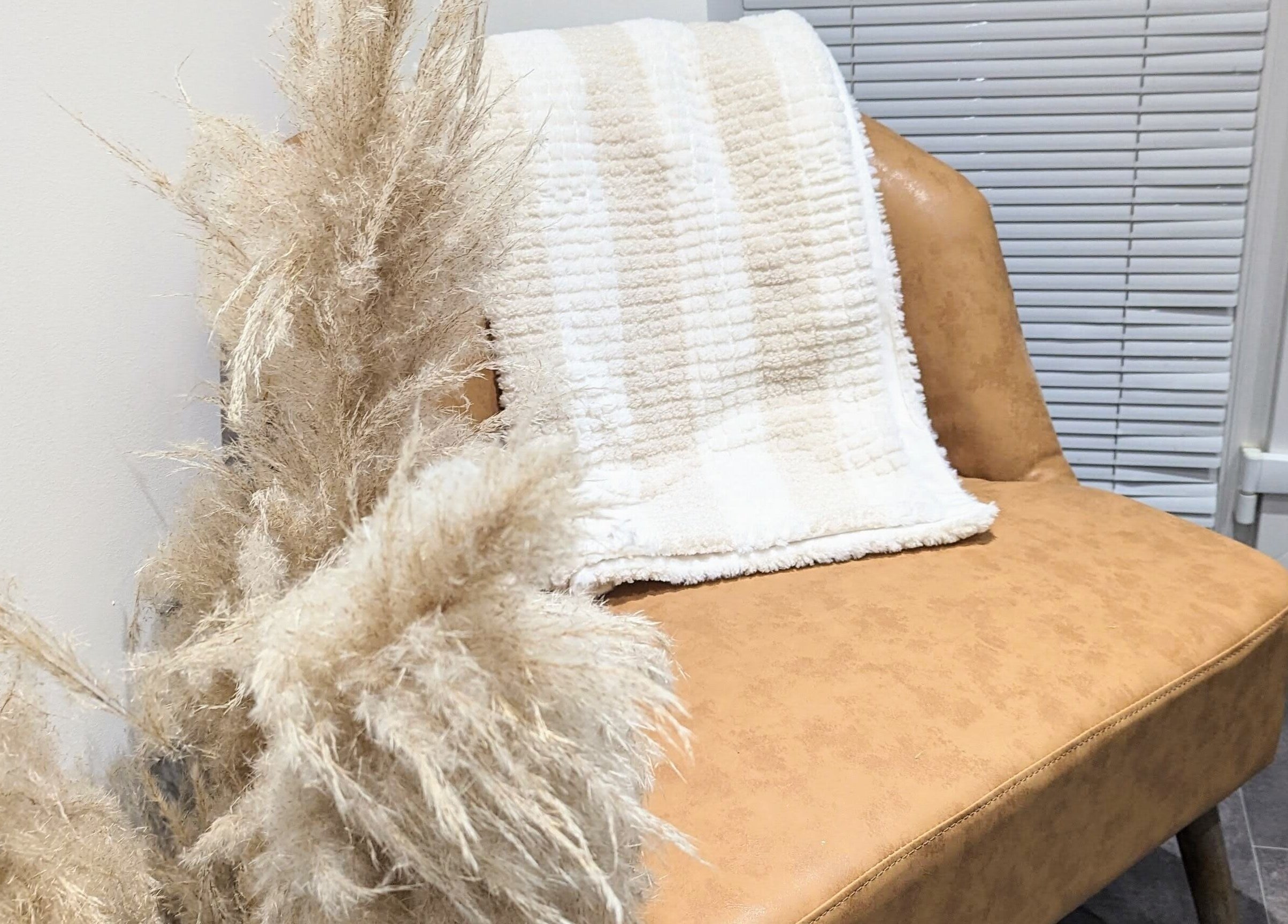 Relaxing tan chair with plush blanket at BrowHouse, Hollingwood, England, GB offering a serene ambiance.