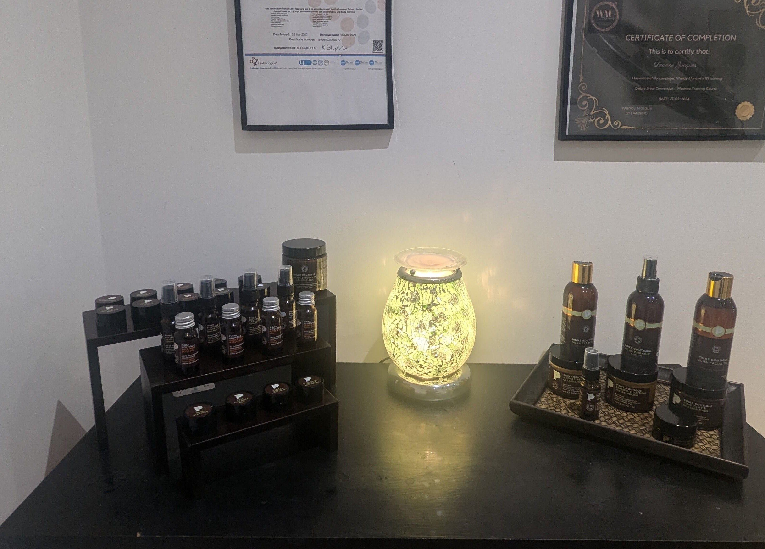Aromatherapy oils and skincare products at BrowHouse, Hollingwood, England, GB, showcasing a serene atmosphere.