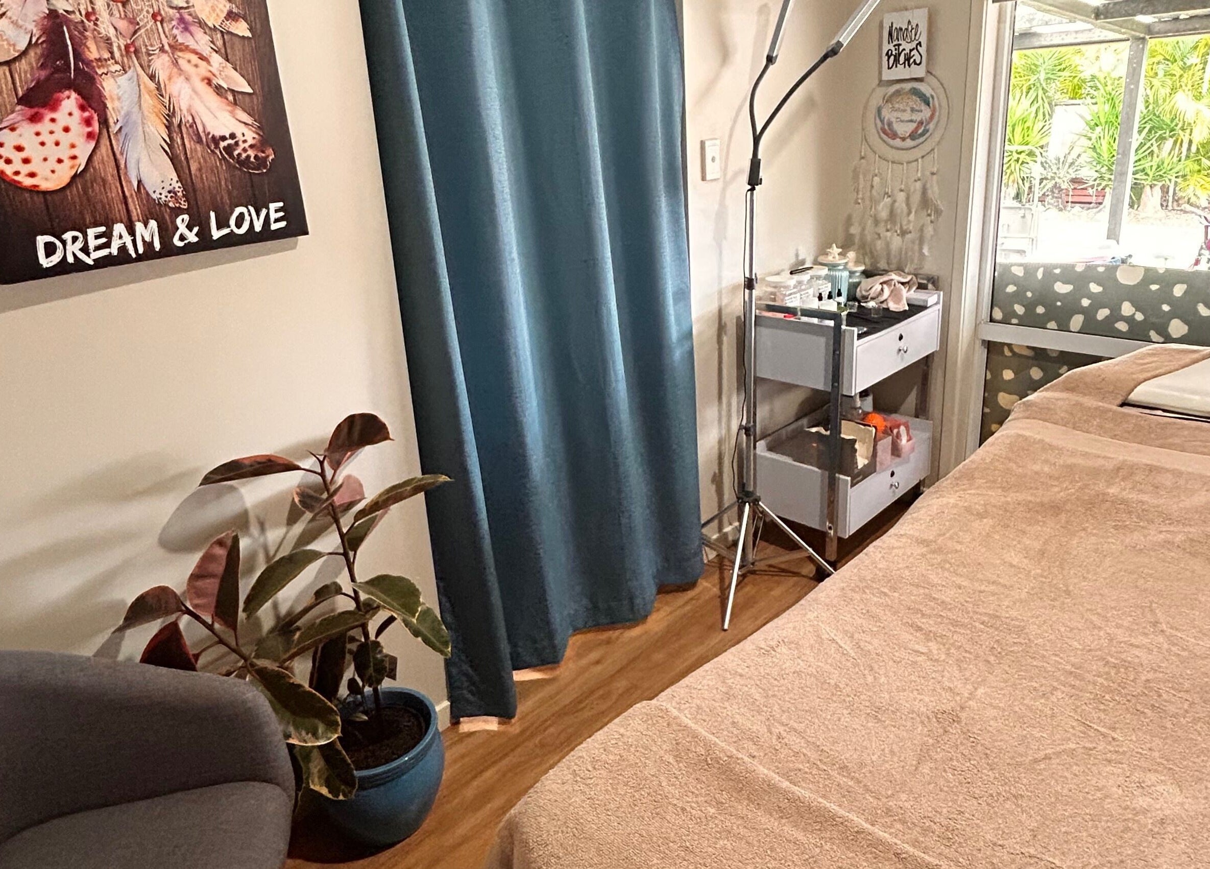 Relaxing treatment room at Wild Soul Connection in Hillcrest, Queensland, AU with cozy decor and soft lighting.