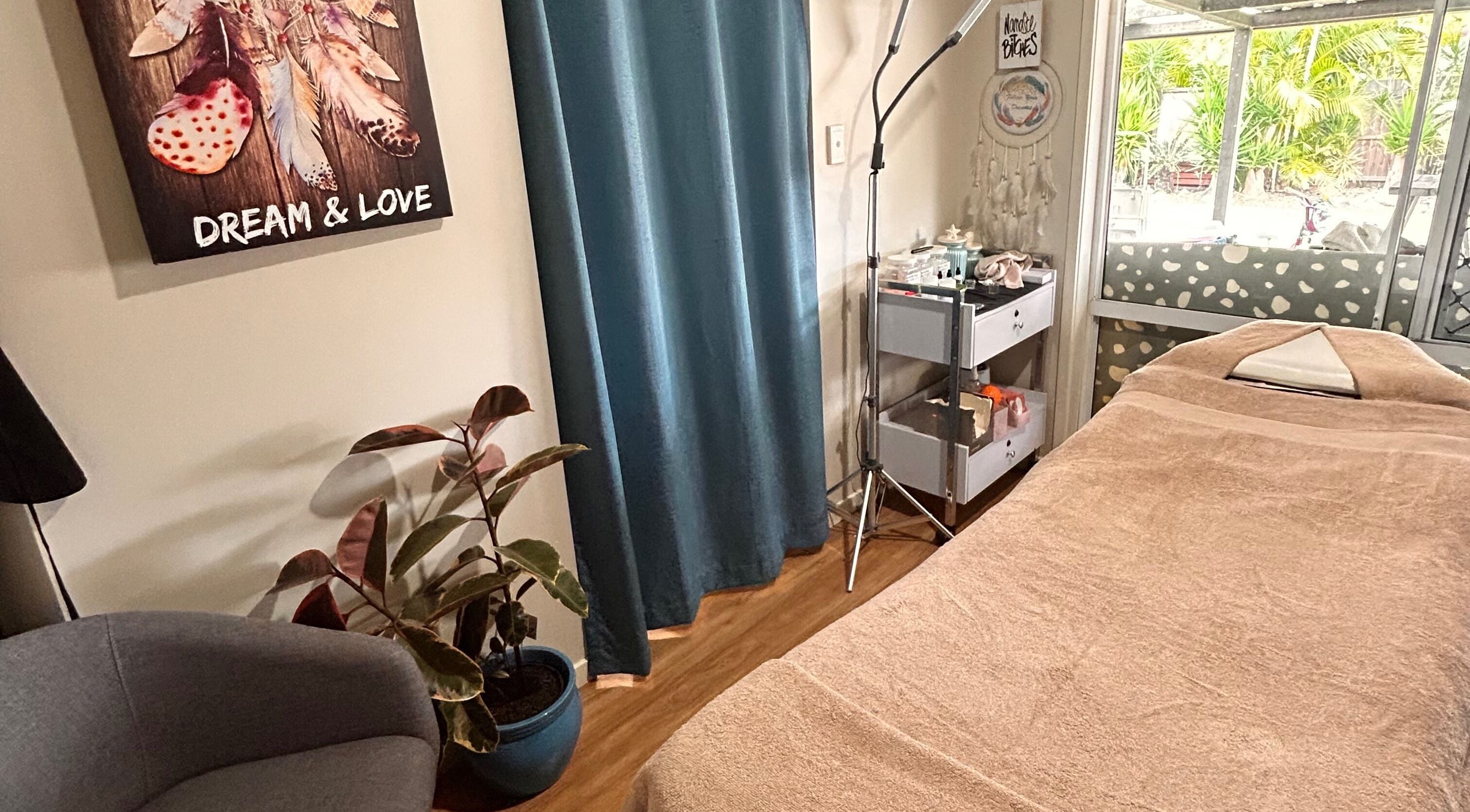 Relaxing treatment room at Wild Soul Connection in Hillcrest, Queensland, AU with cozy decor and soft lighting.