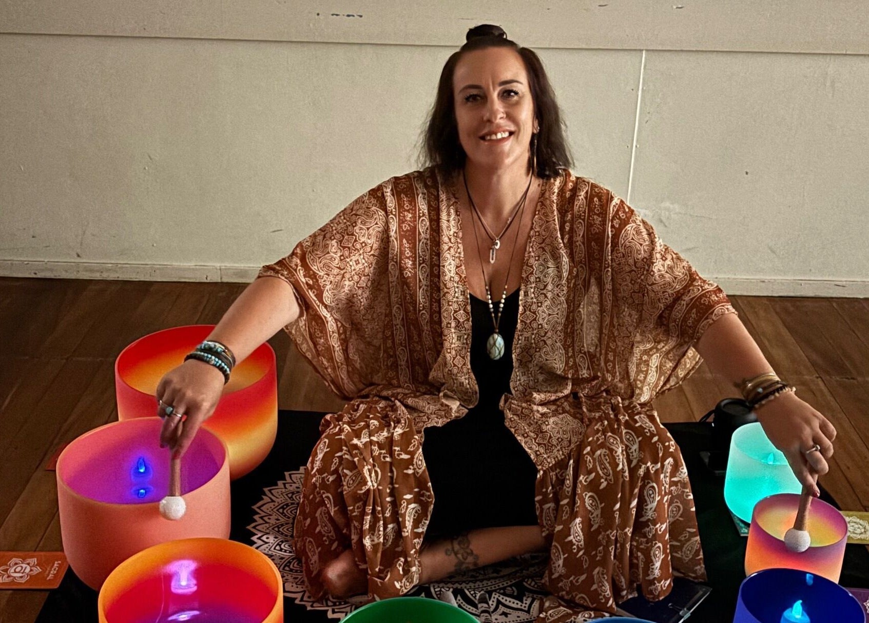 Sound healing session at Wild Soul Connection in Hillcrest, Queensland, AU with vibrant singing bowls.