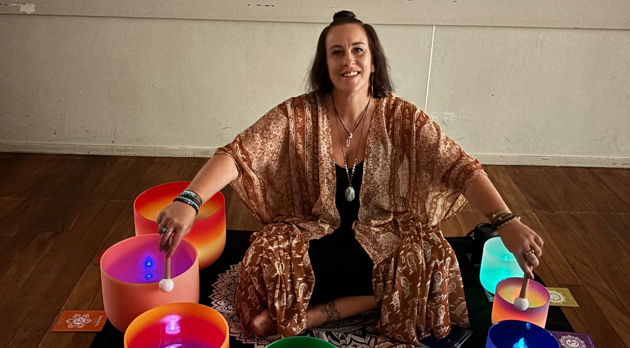 Sound healing session at Wild Soul Connection in Hillcrest, Queensland, AU with vibrant singing bowls.