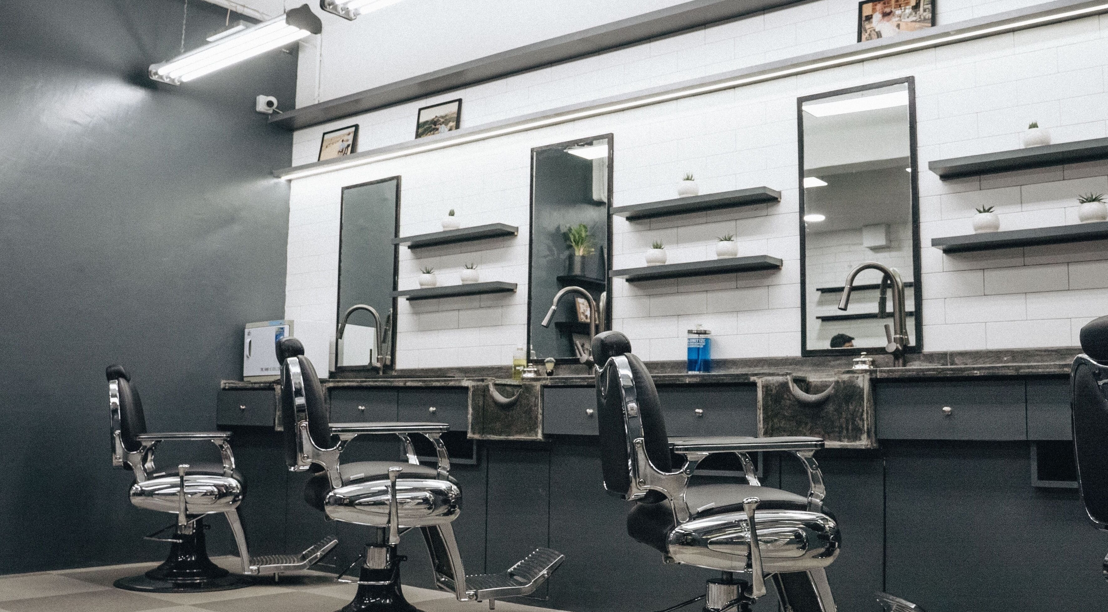 Modern barber chairs and mirrors at Nomad Barber - Mumbai, Mumbai, Maharashtra, IN.