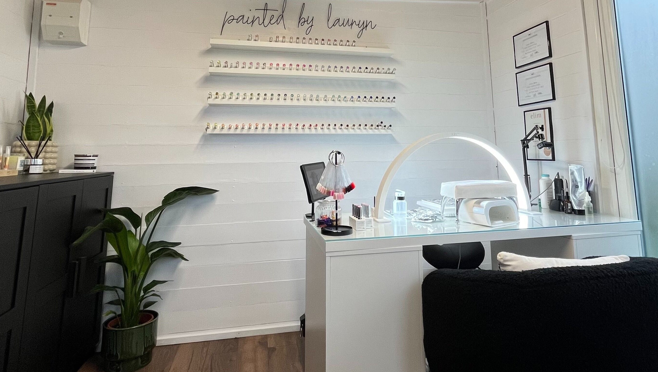 Elegant nail salon interior at Painted By Lauryn, Hayes, England, GB, showcasing a modern manicure station.