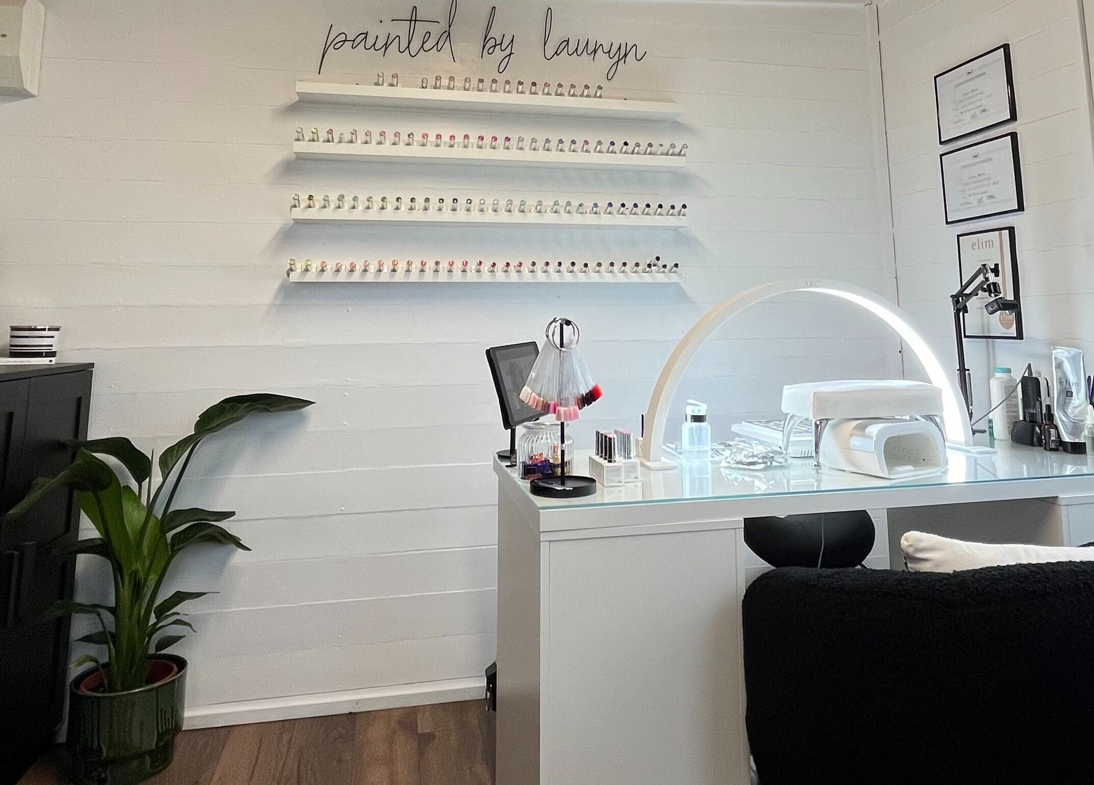 Elegant nail salon interior at Painted By Lauryn, Hayes, England, GB, showcasing a modern manicure station.