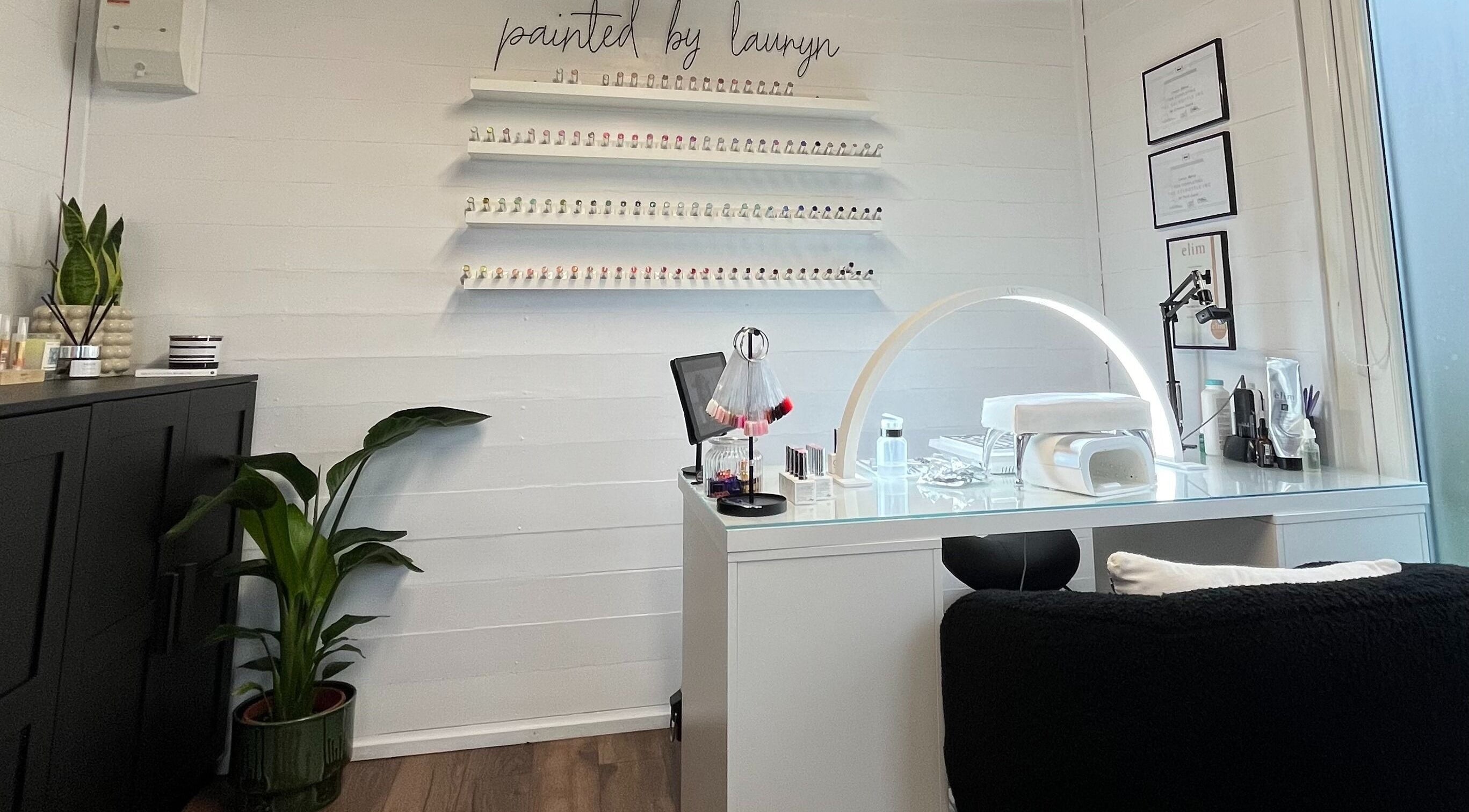 Elegant nail salon interior at Painted By Lauryn, Hayes, England, GB, showcasing a modern manicure station.
