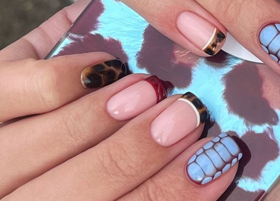 Elegant nail art with mixed patterns at Painted By Lauryn, Hayes, England, GB.