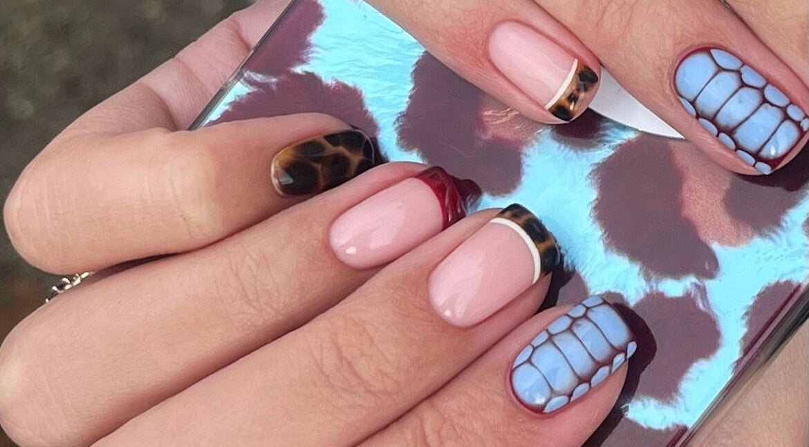 Elegant nail art with mixed patterns at Painted By Lauryn, Hayes, England, GB.