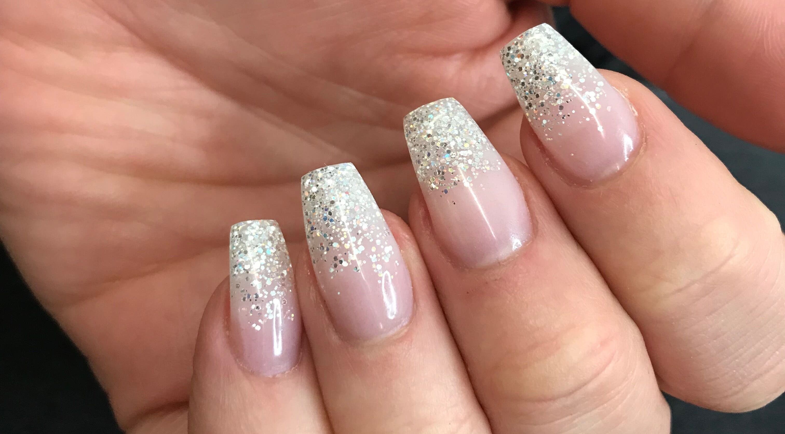 Nail art with glitter tips at Alyss Marie Beauty in Wombwell, England, GB.