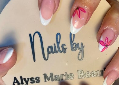Floral nail art on French tips at Alyss Marie Beauty, Wombwell, England, GB, showcasing expert manicure skills.